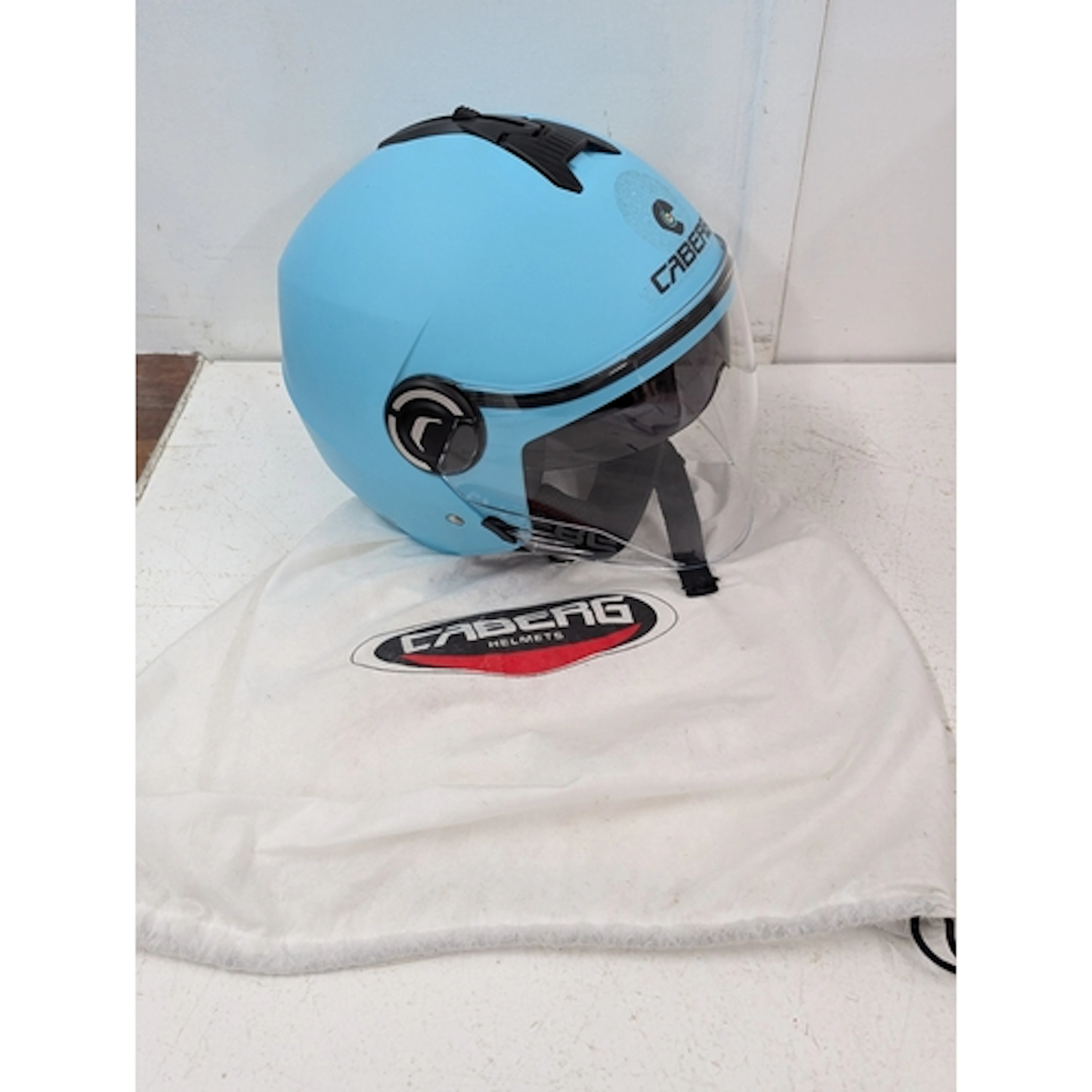 Motorcycle helmet, a Caberg branded motorcycle helmet and pr...
