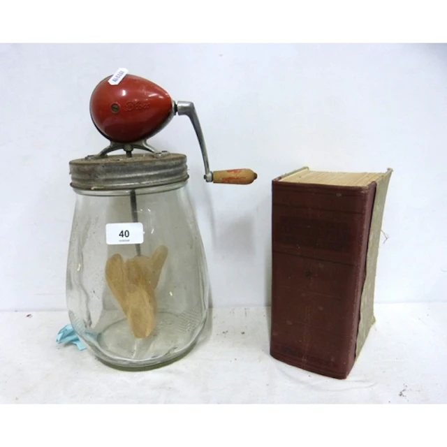 Vintage butter churn and Mrs Beeton's Household Management b...