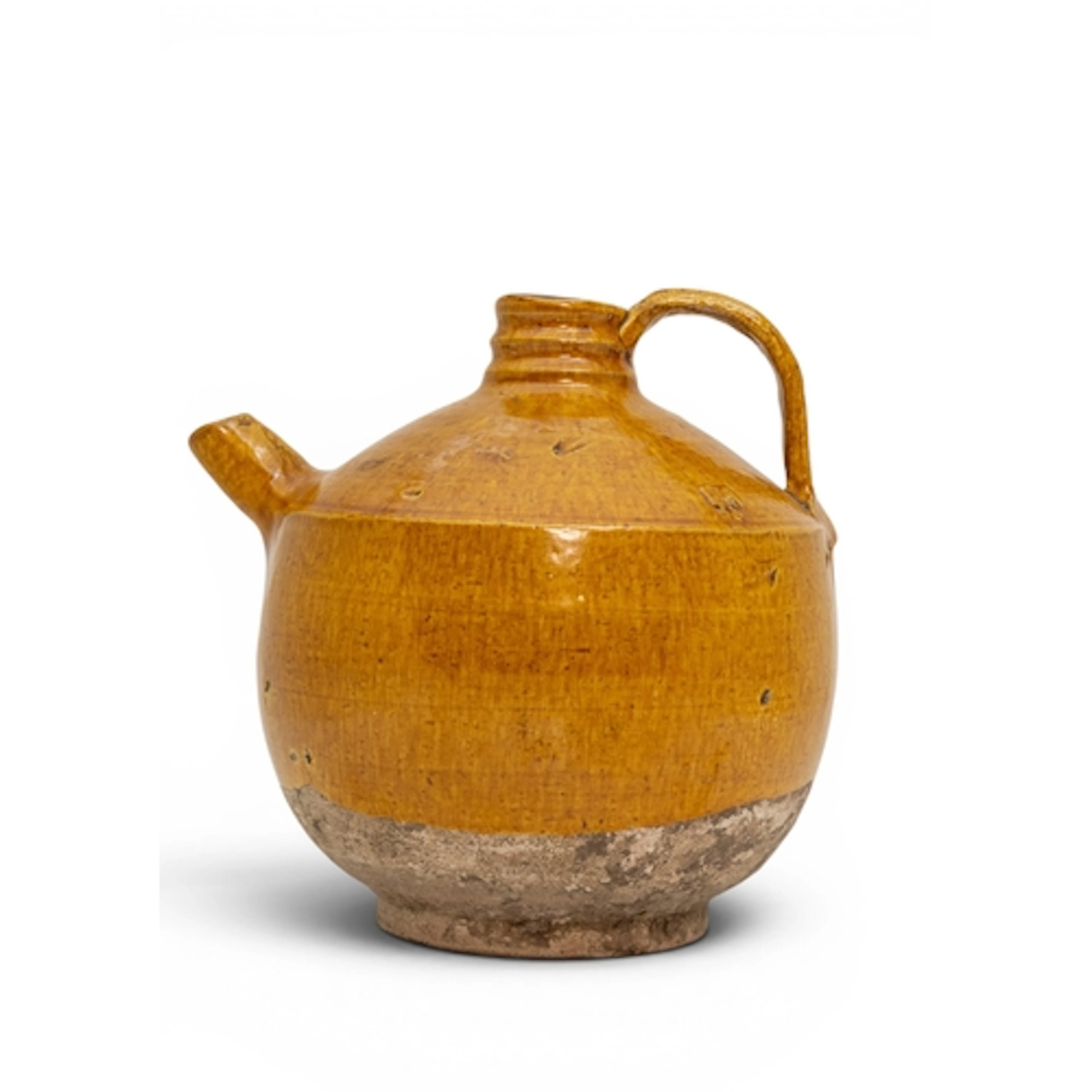 A CHINESE POTTERY RICH AMBER-GLAZED EWER WITH STRAP HANDLE L...