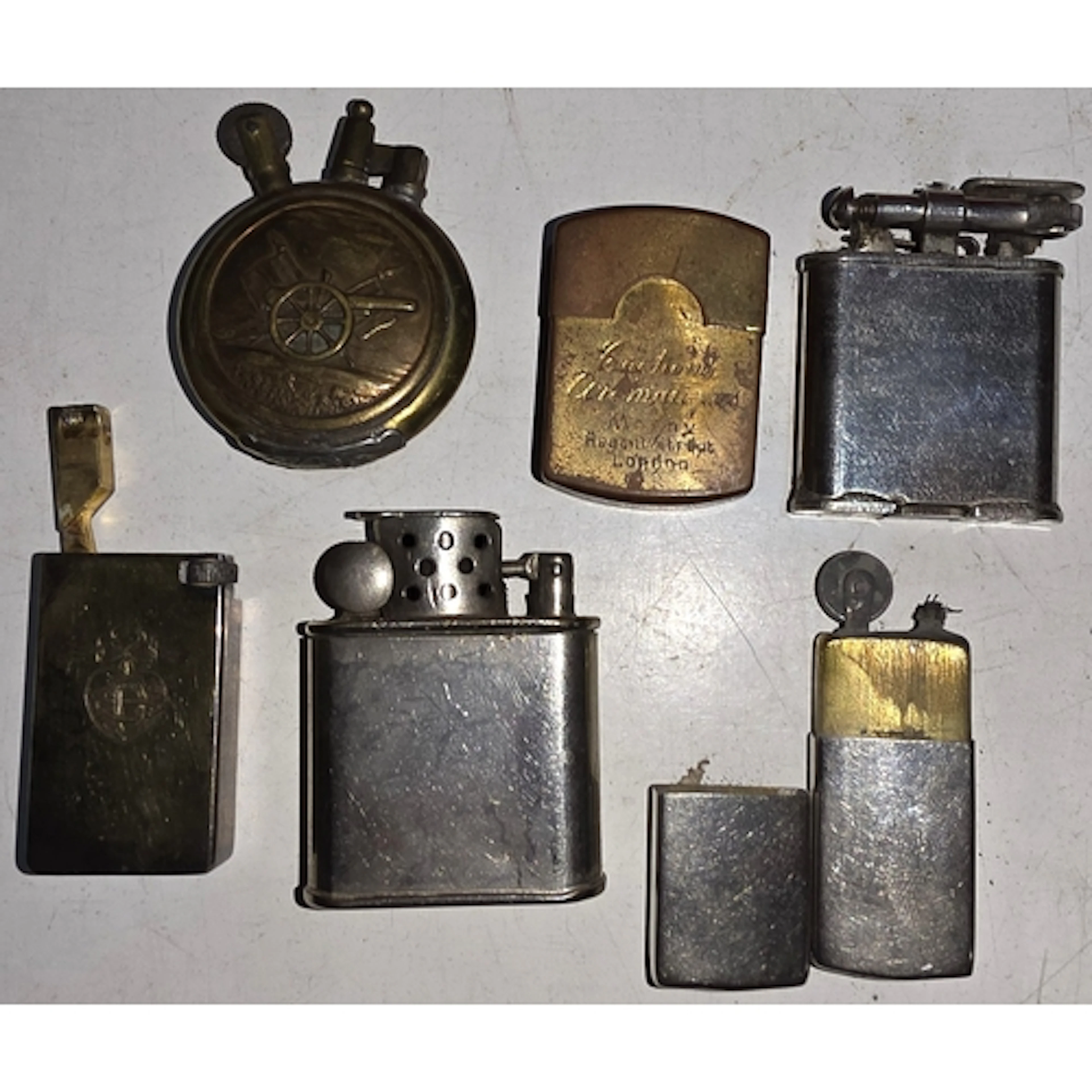 A mid 20th century gilt on white metal lighter, base marked,...
