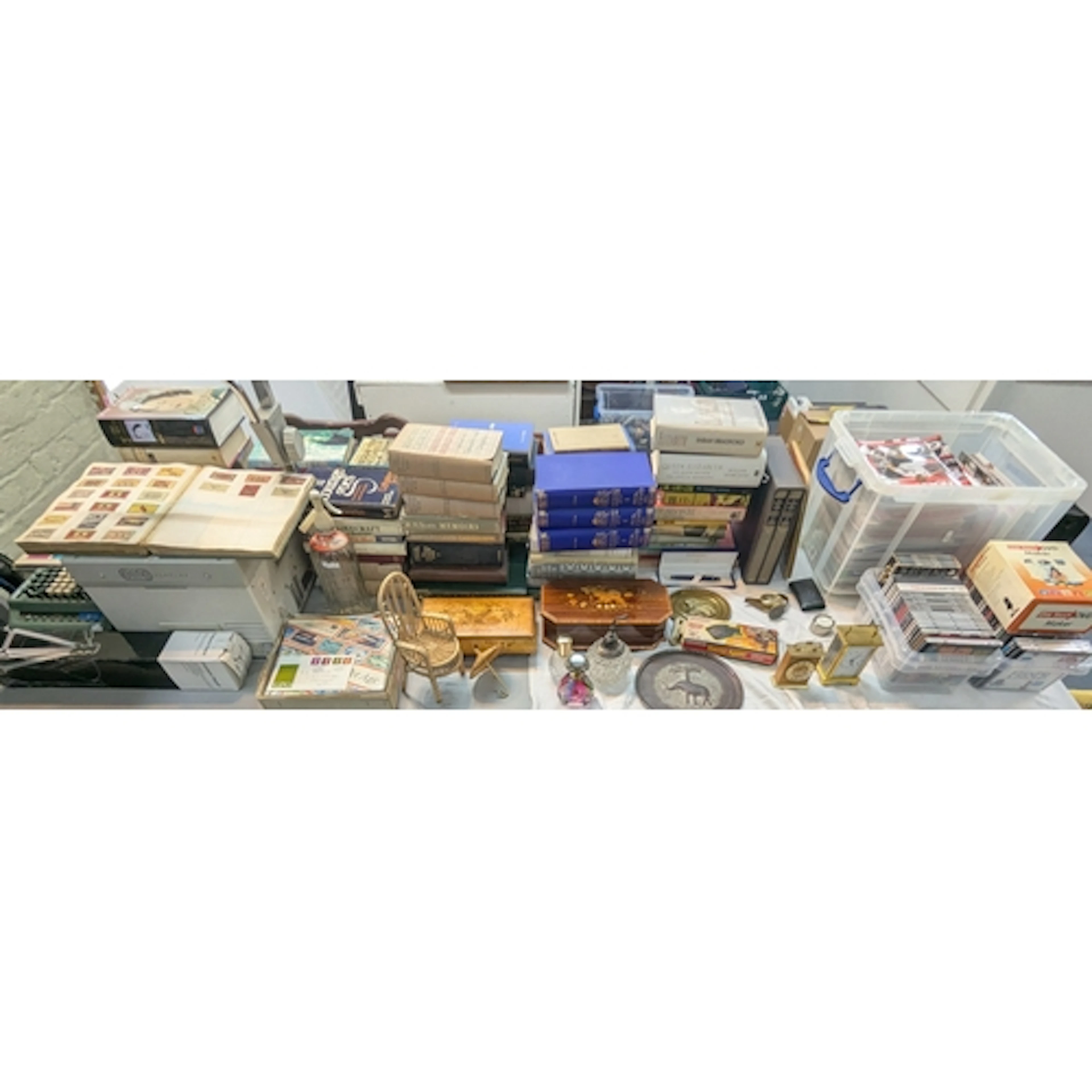 A large mixed lot to include books, carriage clock, CDs, rec...