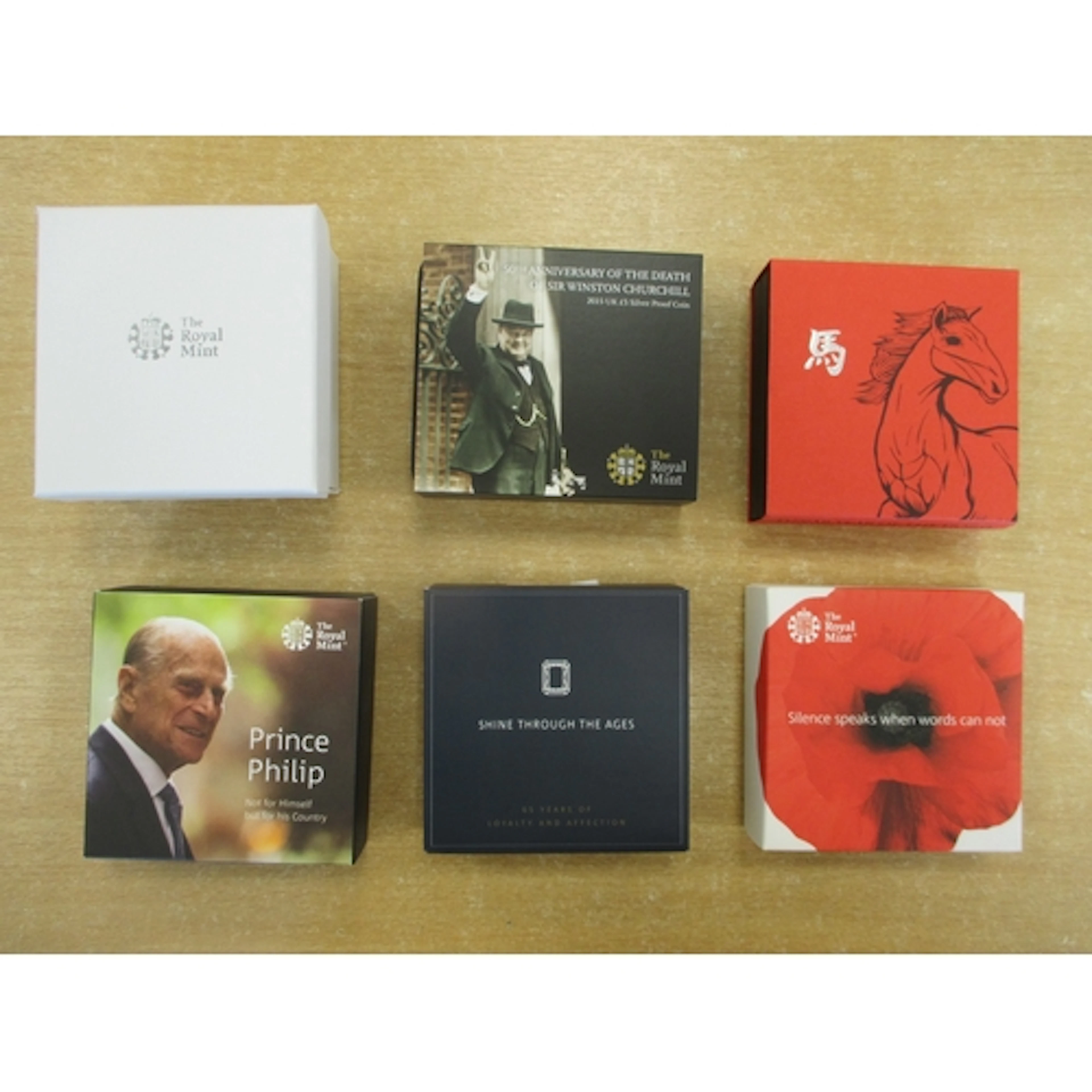 Mixed collection of boxed Royal Mint commemorative silver pr...