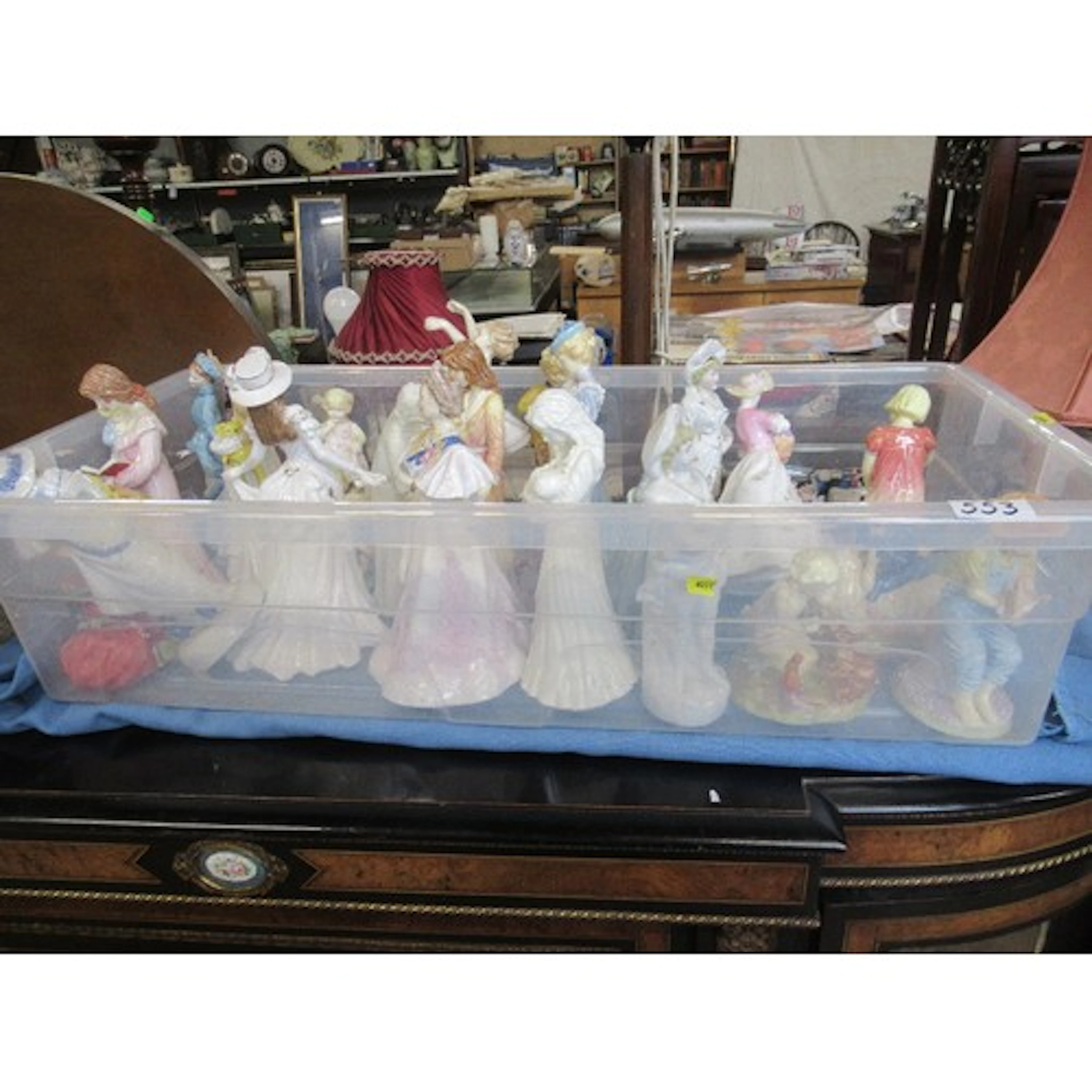 A box of assorted figurines to include Royal Worcester
