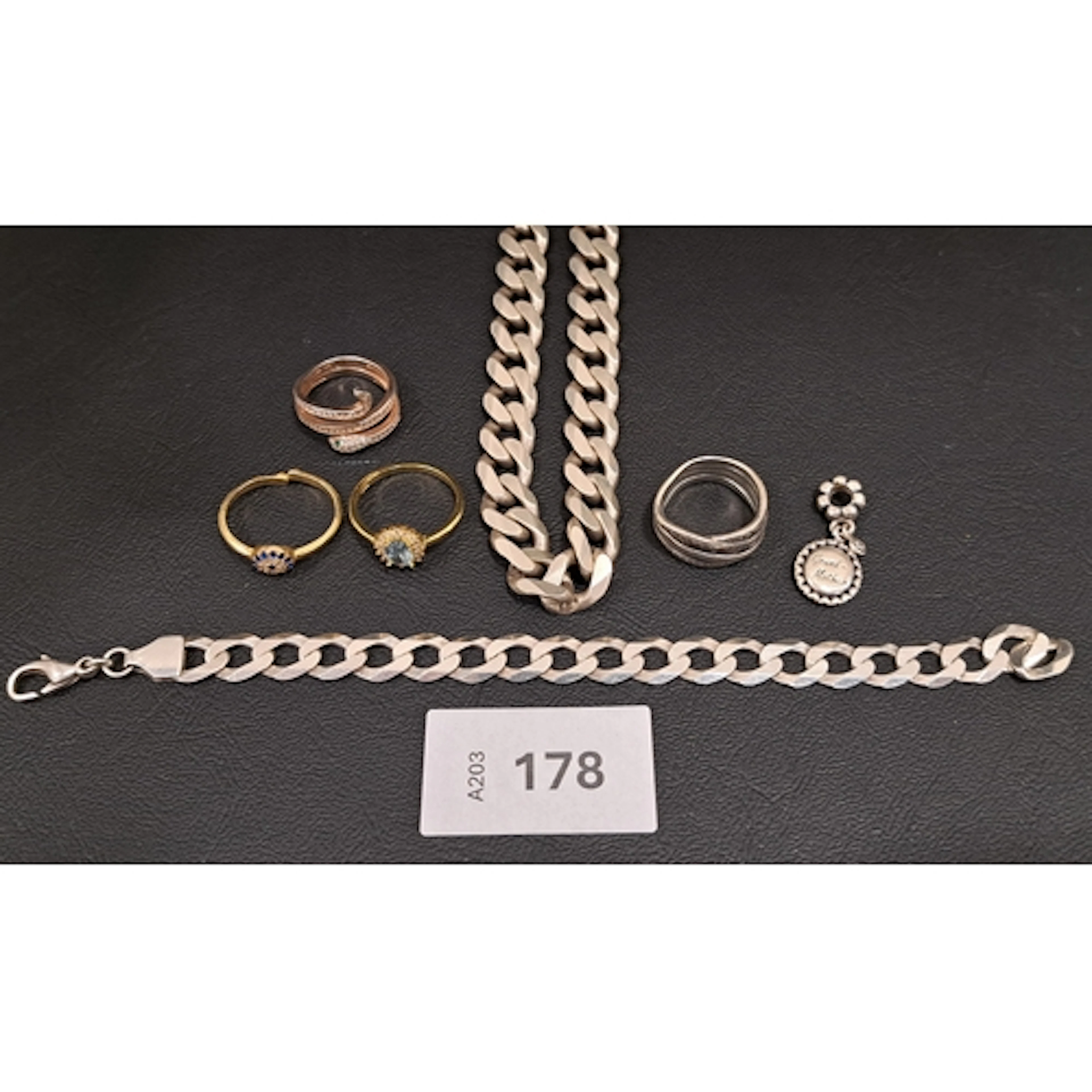 SEVEN PIECES OF SILVER JEWELLERY comprising a heavy curb lin...