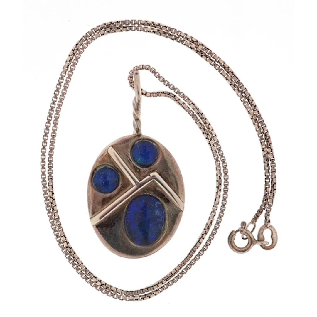 Arts & Crafts style unmarked silver pendant, set with opales...