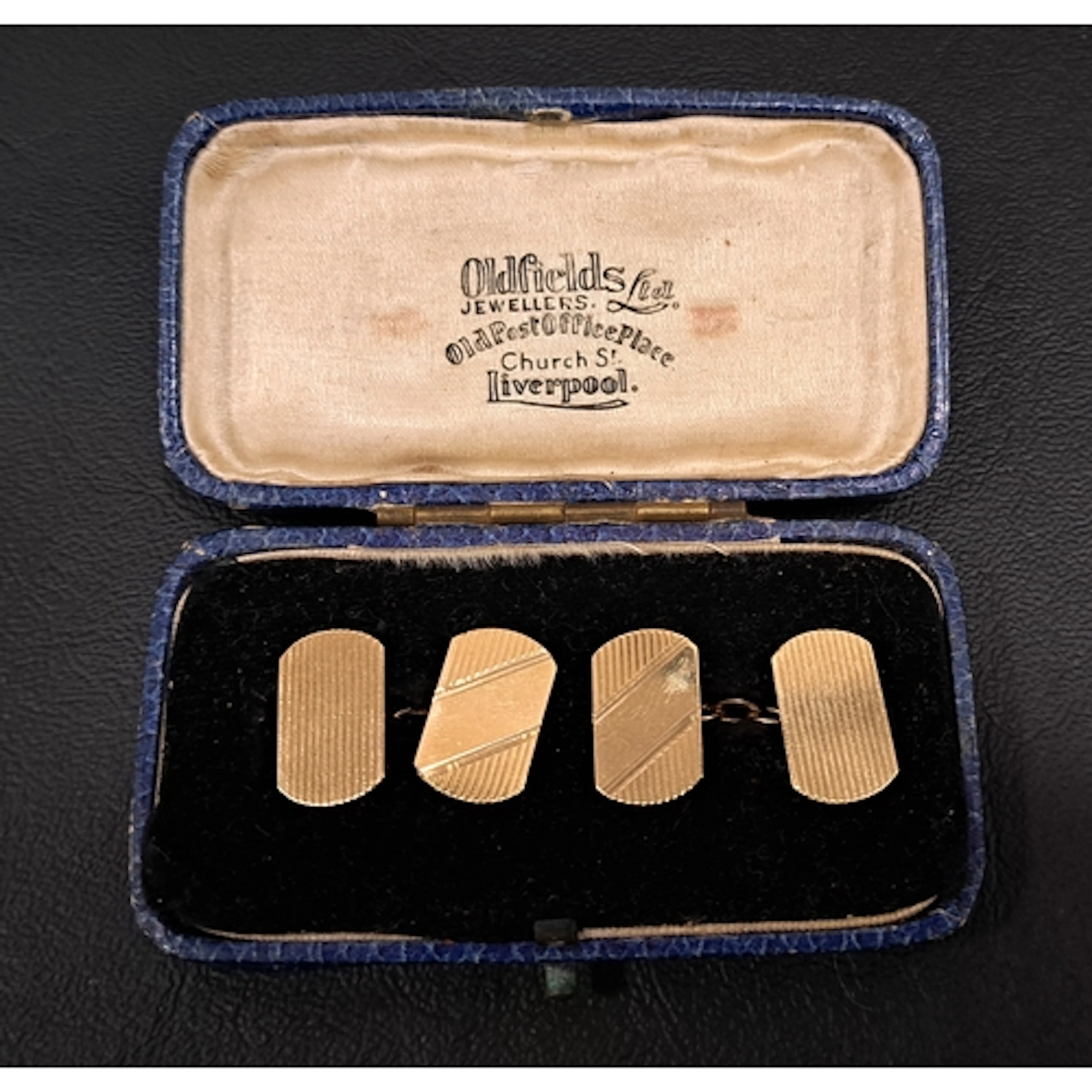 PAIR OF NINE CARAT GOLD CUFFLINKS with engine turned decorat...