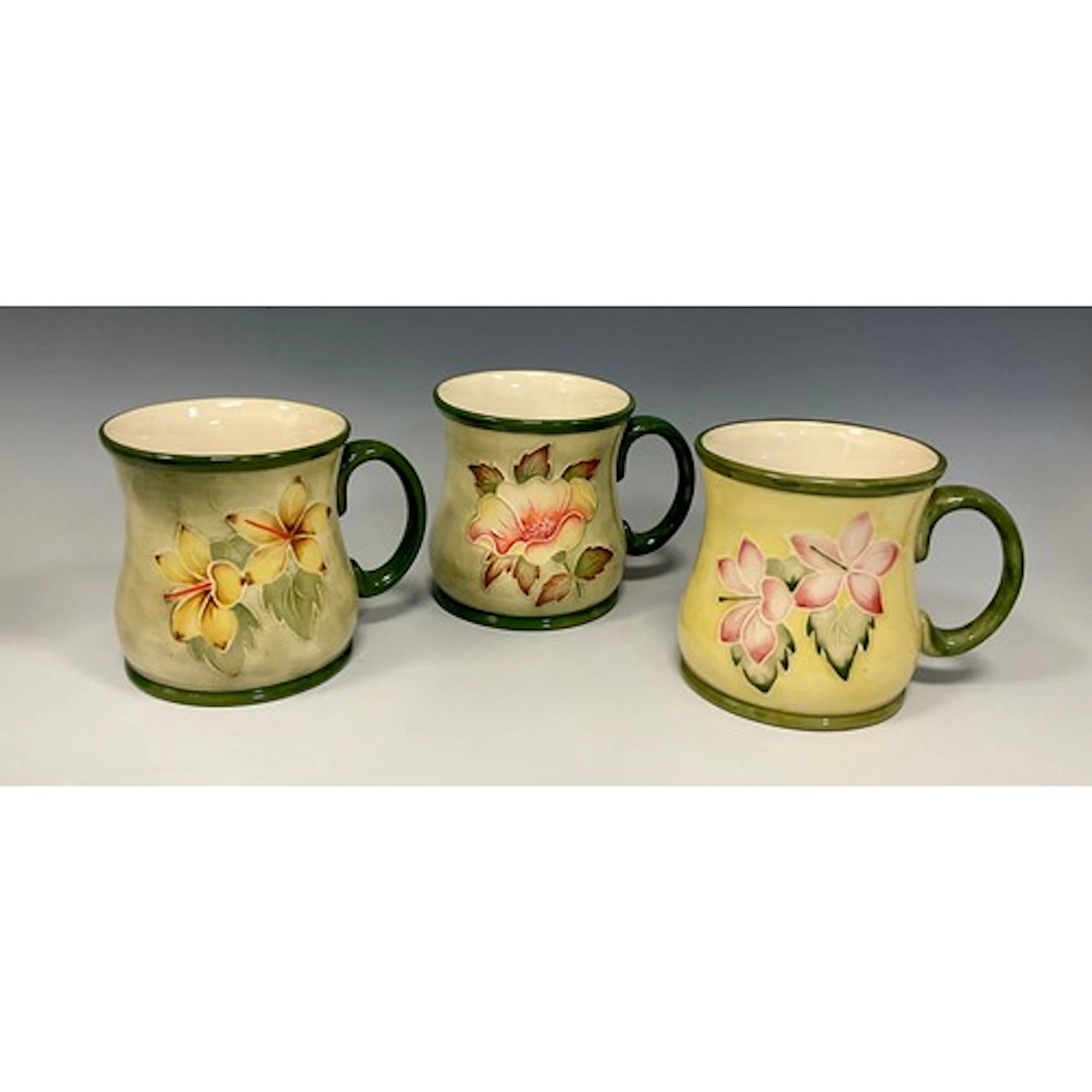 Moorcroft - a pair of mugs in pink and yellow clematis patte...