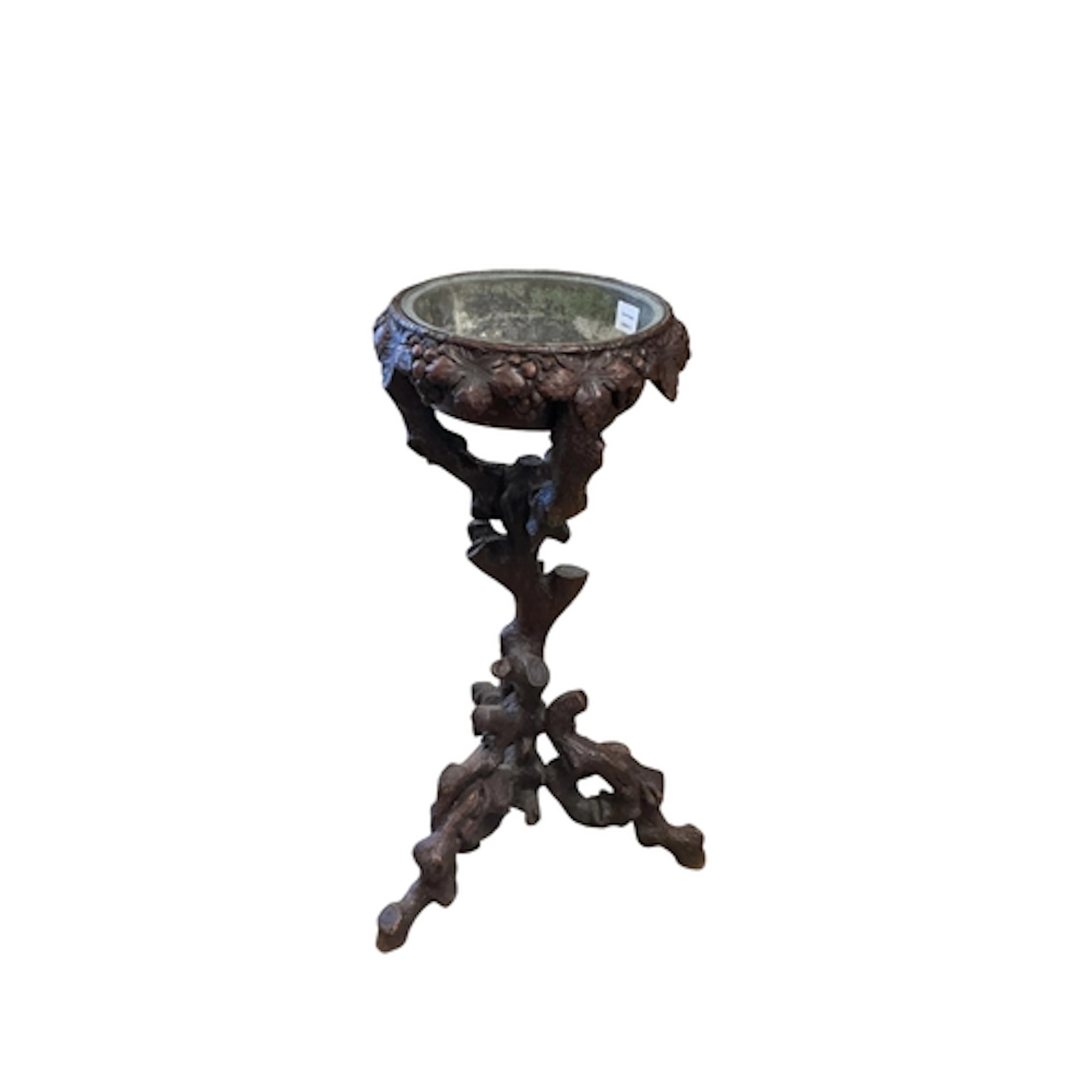 A Black Forest jardiniere table, diameter 50cm, height 82cm...