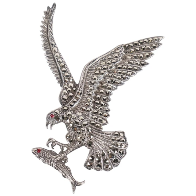 A large sterling silver and marcasite eagle catching fish br...