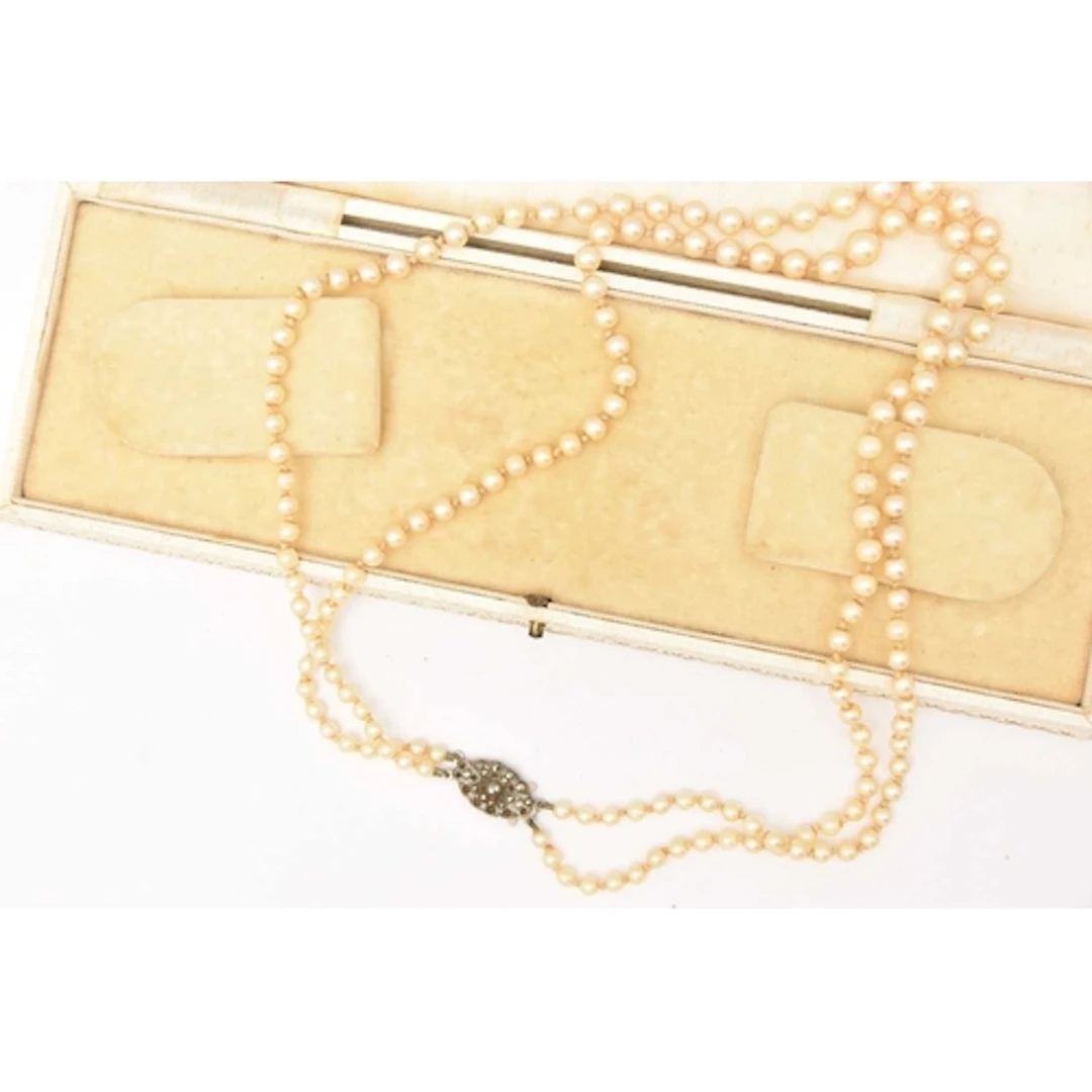 A CULTURED PEARL DOUBLE STRAND NECKLACE, individually knotte...