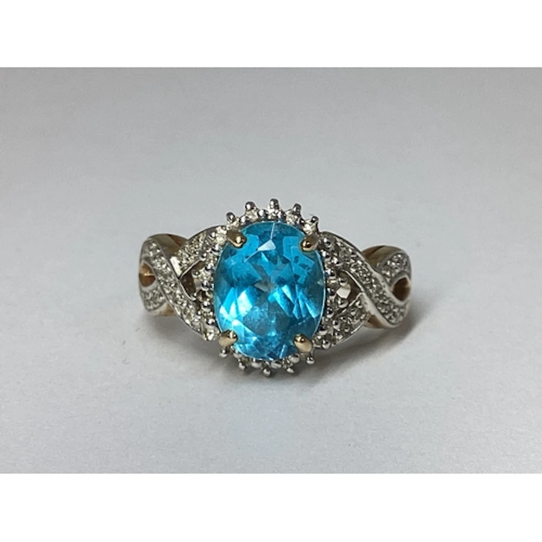 A Decorative Claw Set Cluster Ring, the oval centre stone wi...