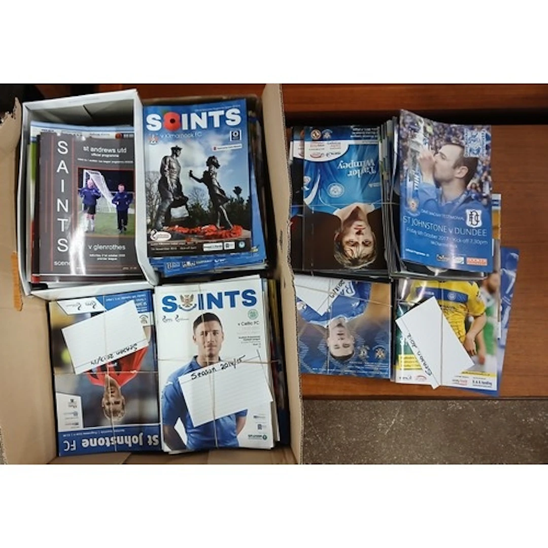 Box of assorted St Johnston match day football programmes.