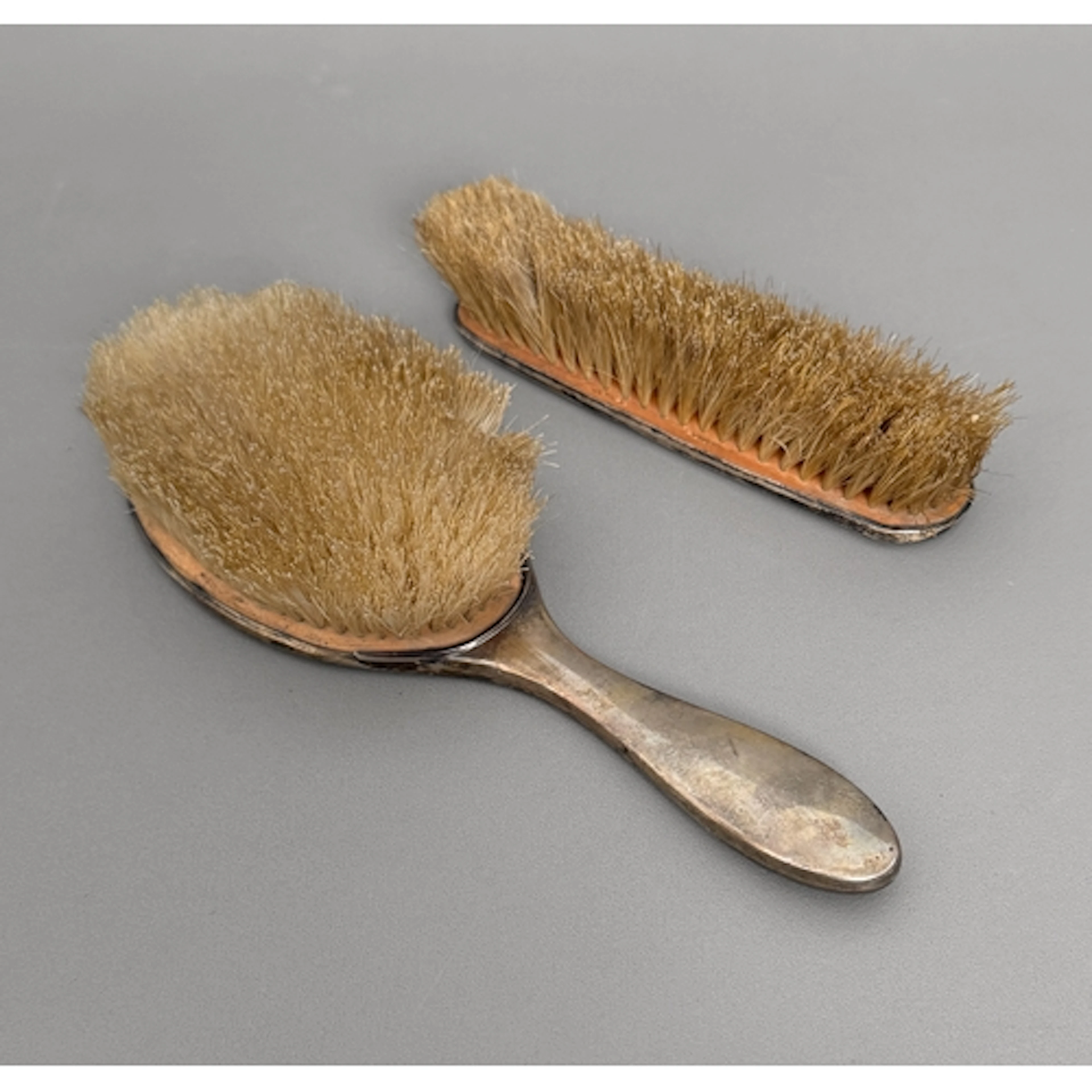 A George V silver and tortoiseshell mounted hairbrush and cl...