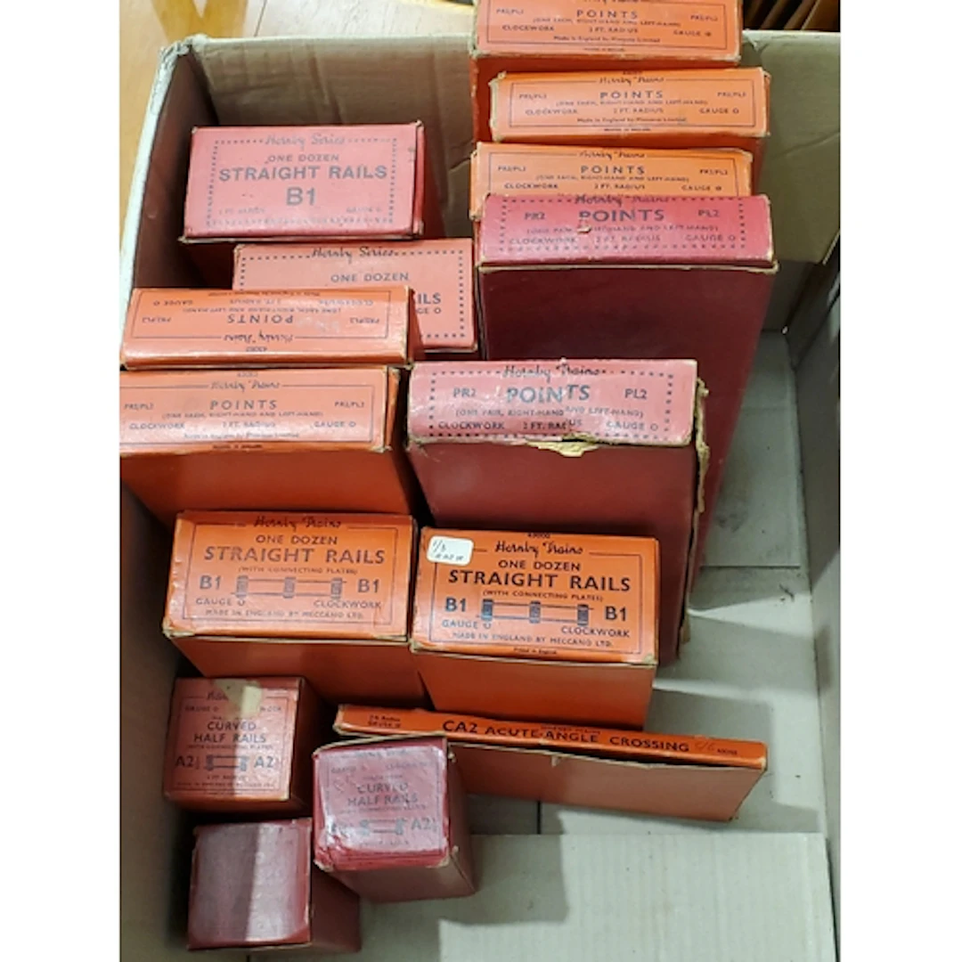 A box of boxed Hornby 0 gauge clockwork Track comprising 4x ...
