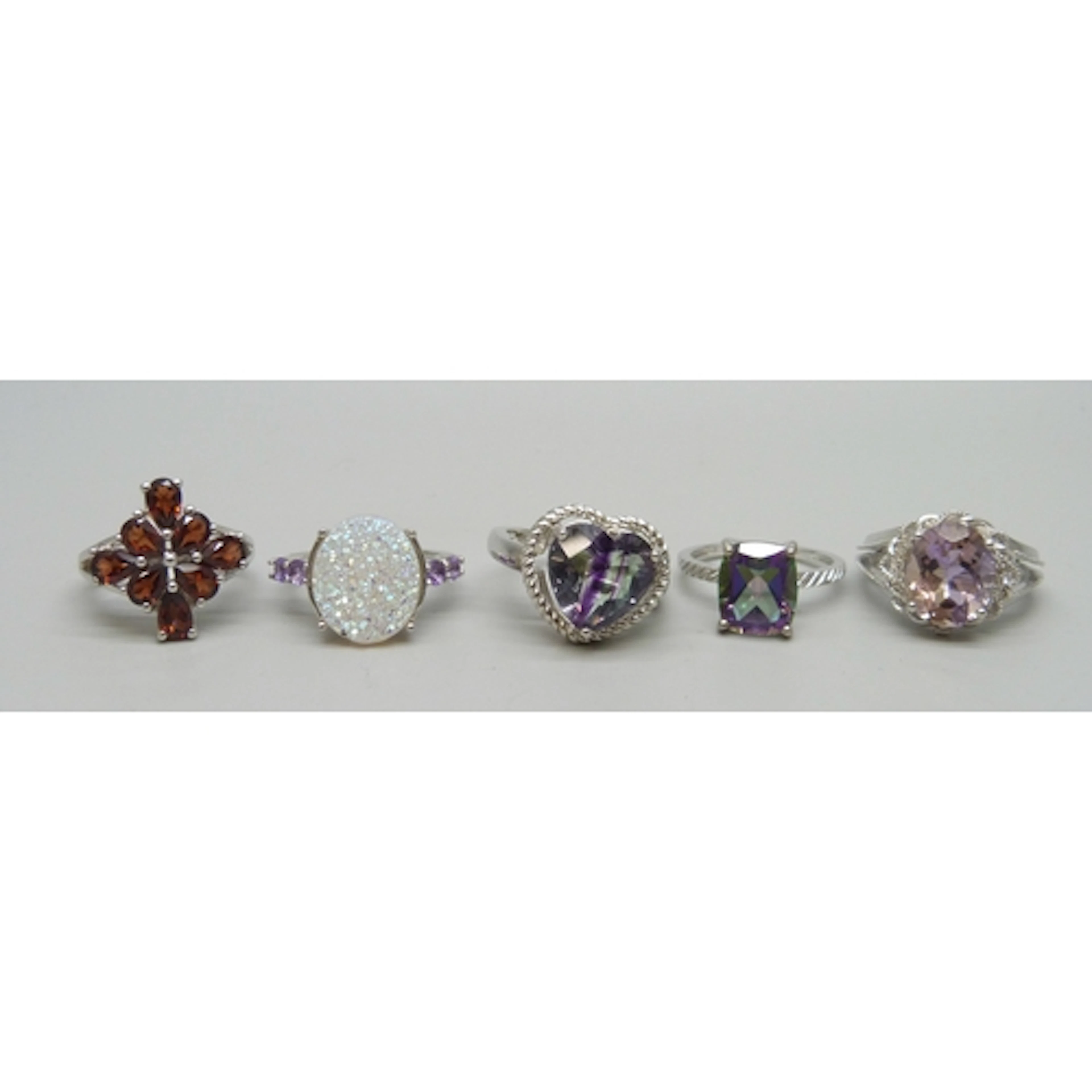A collection of four TGGC gemstone rings, 16g total, and a s...