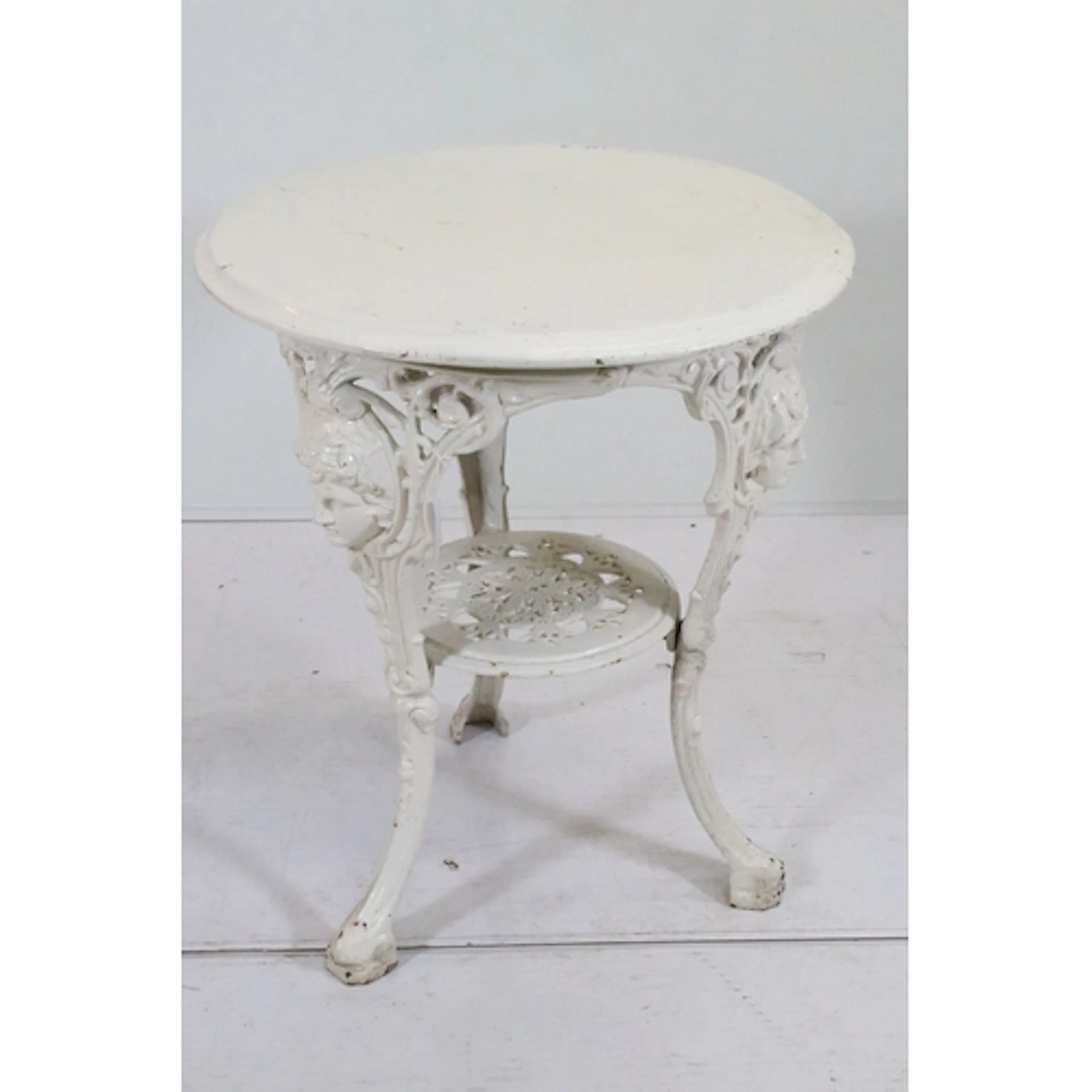 Early 20th century cast iron pub table, having white painted...