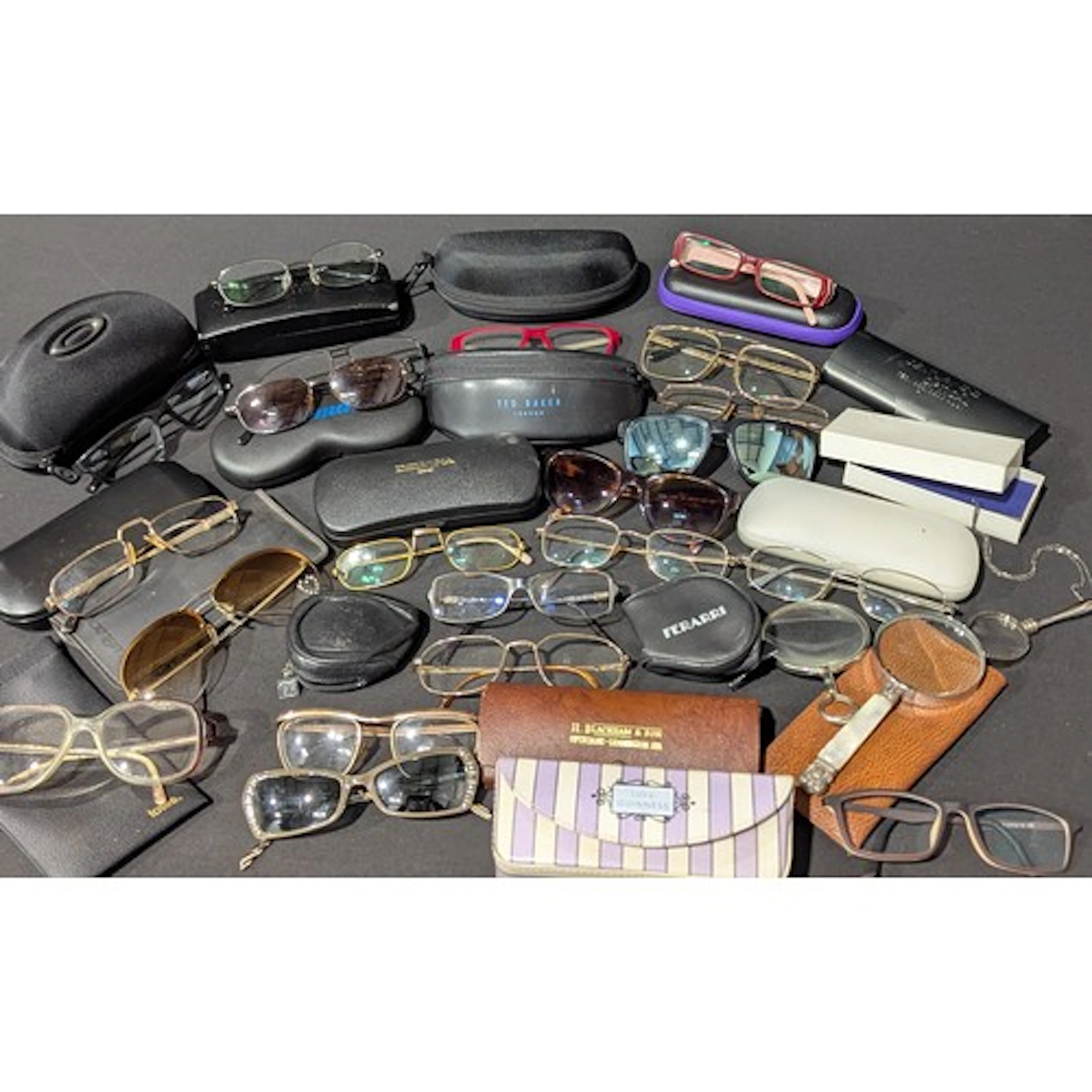 A quantity of glasses and sunglasses,various designers inclu...
