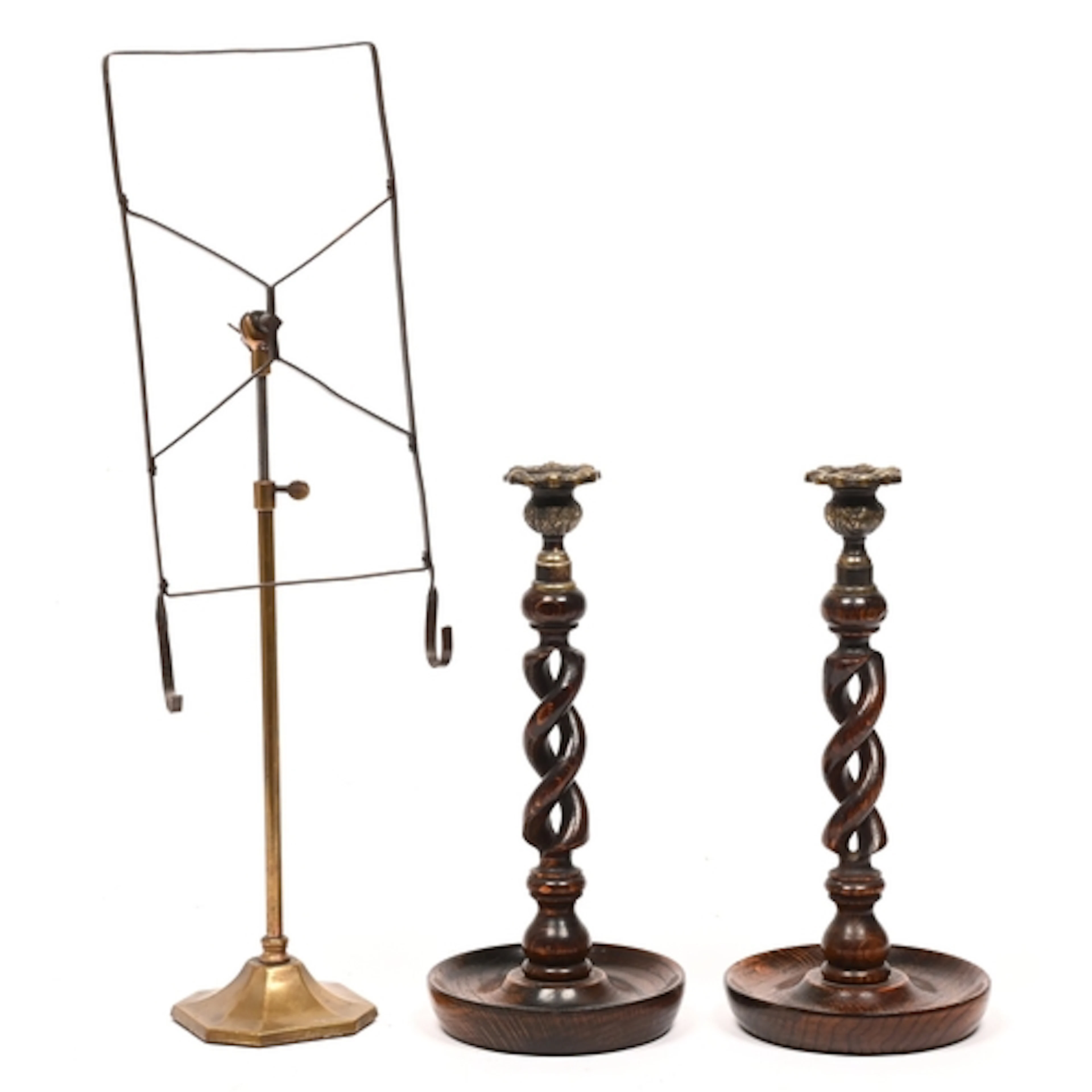 A pair of Victorian spiral turned oak candlesticks, with bra...