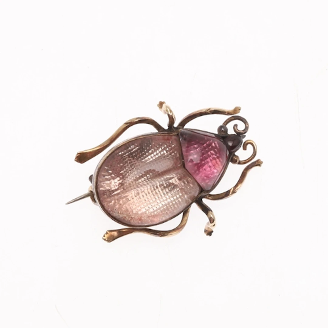 A ROCK CRYSTAL AND GOLD BEETLE BROOCH. the body mounted with...