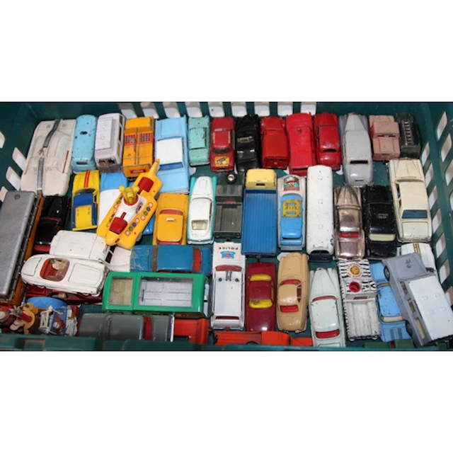 A collection of vintage play worn die-cast vehicles includi...