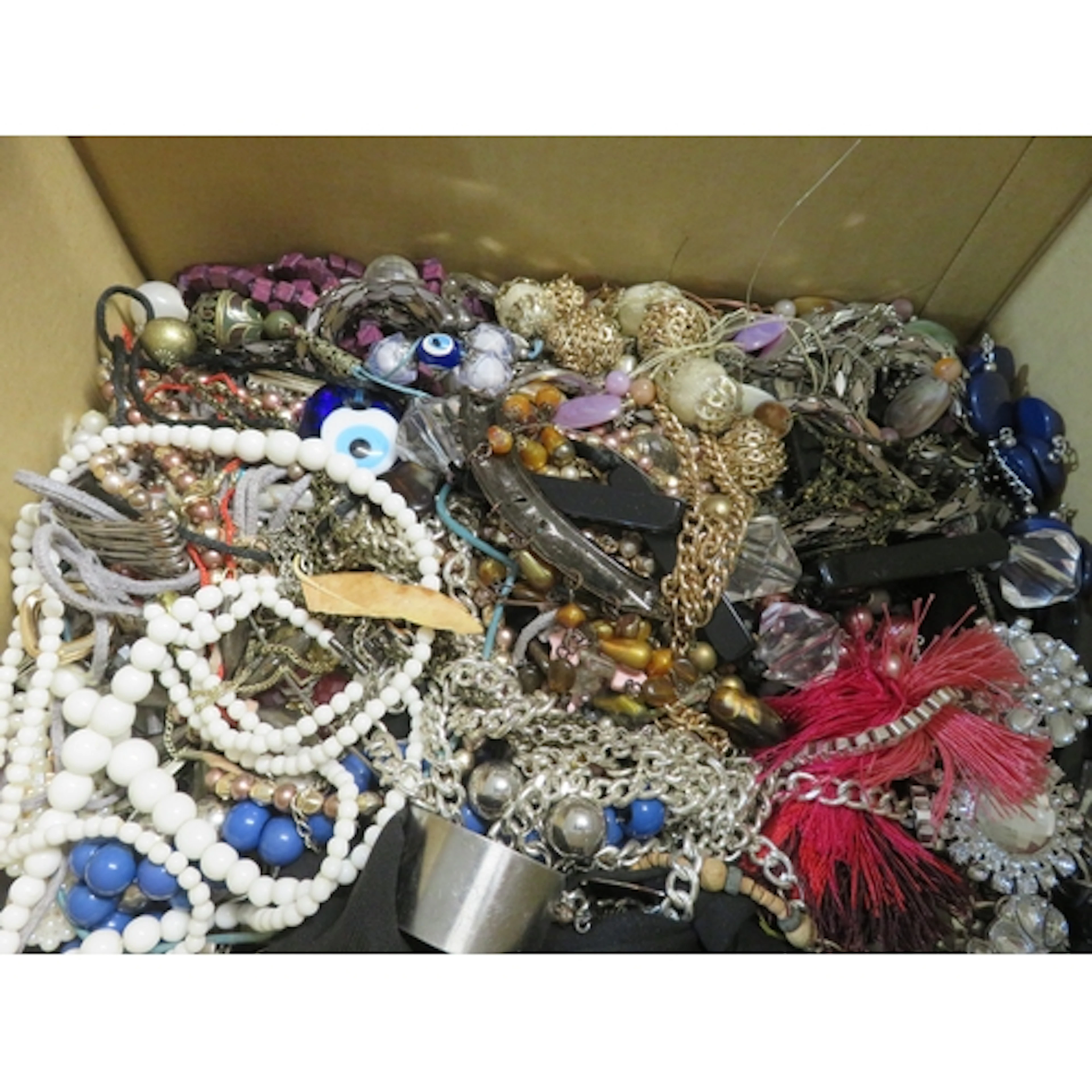Six boxes containing a quantity of various costume jewellery