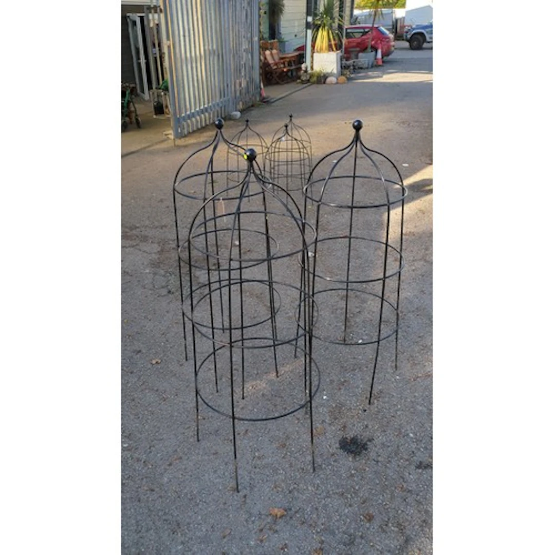 A group of 3 x black-painted metal garden obelisks, each wit...