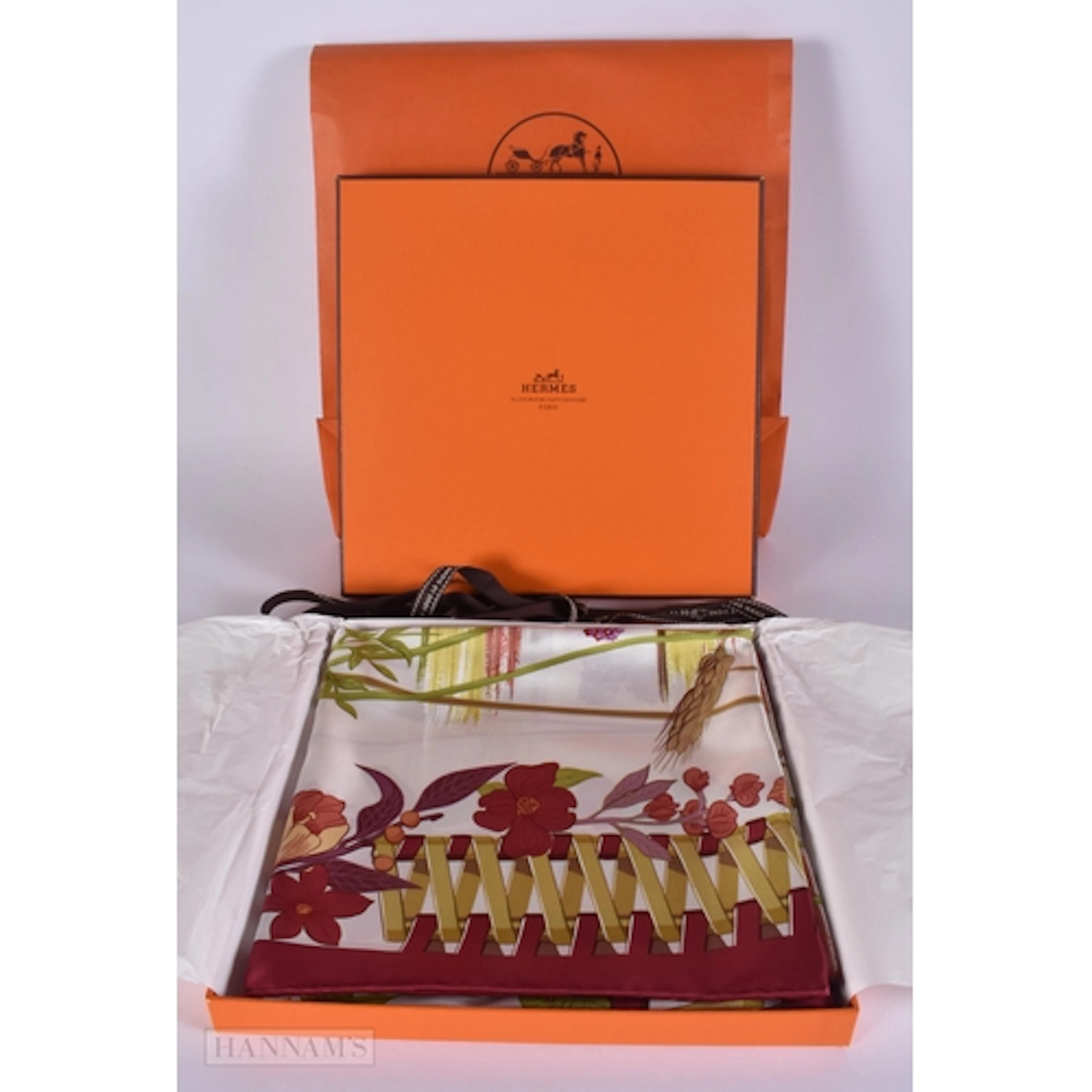 A BOXED FRENCH HERMES LE MAN SILK SCARF.