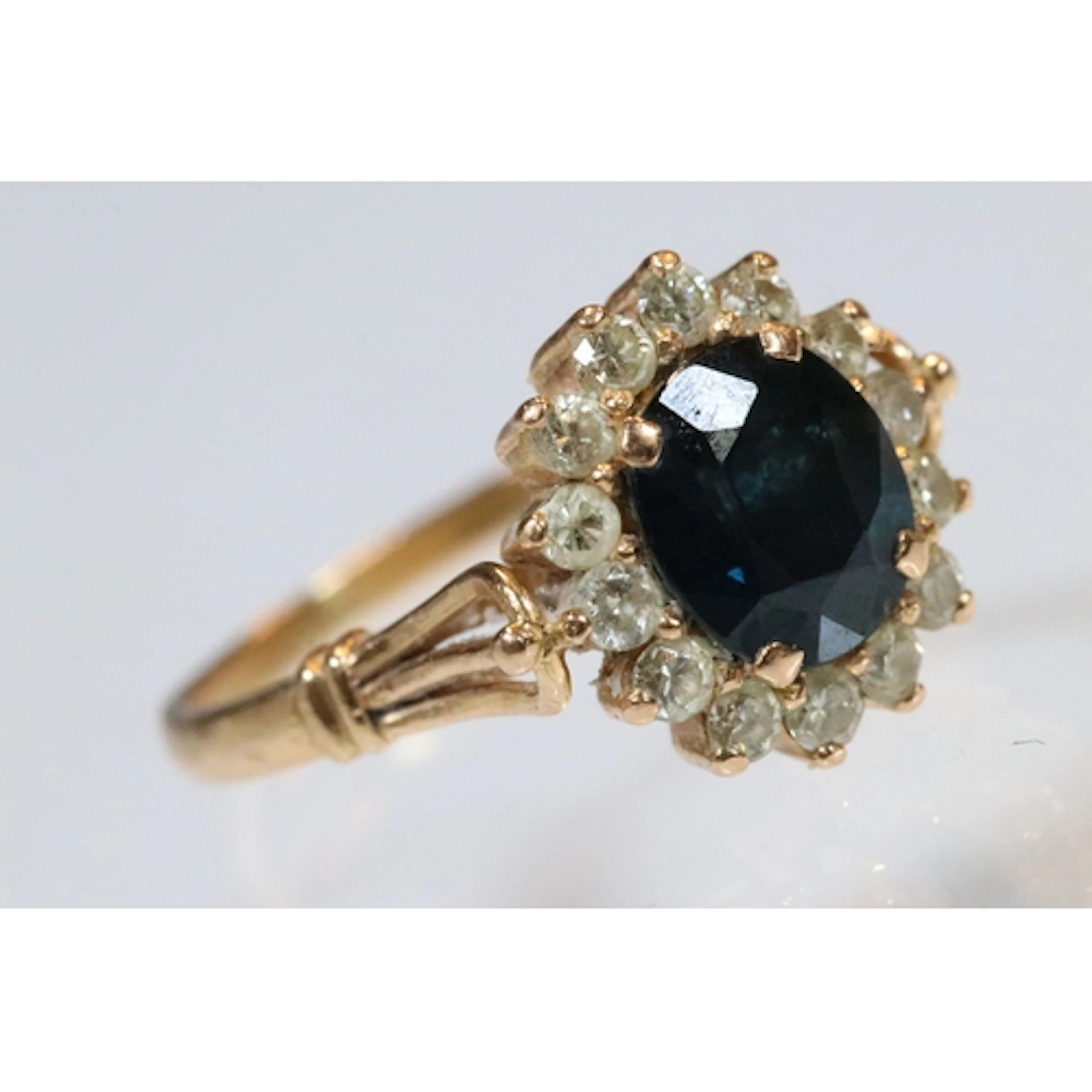 18ct gold, sapphire and diamond ring. The ring being set wit...