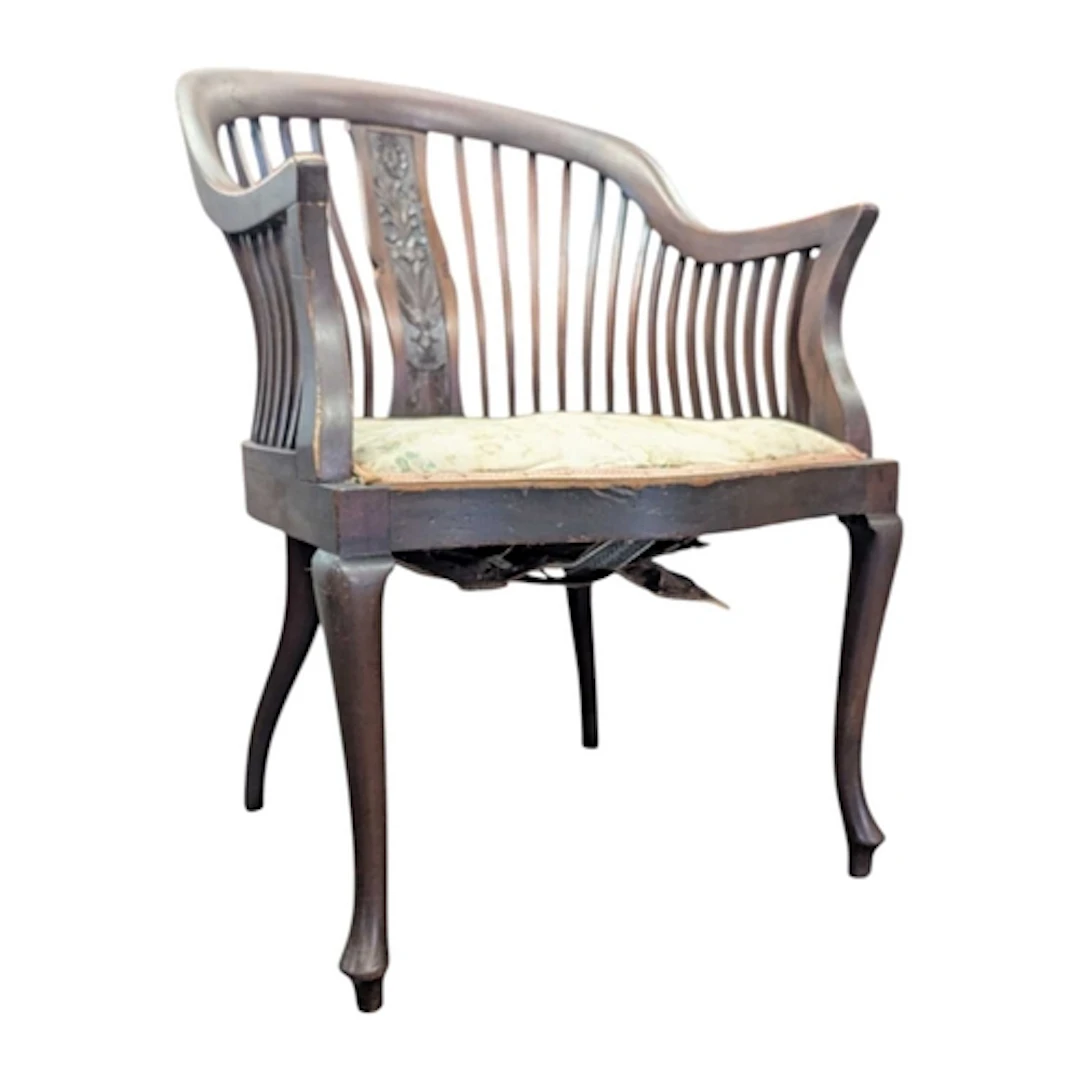 A 19th century Victorian mahogany carved splat tub chair. Ra...