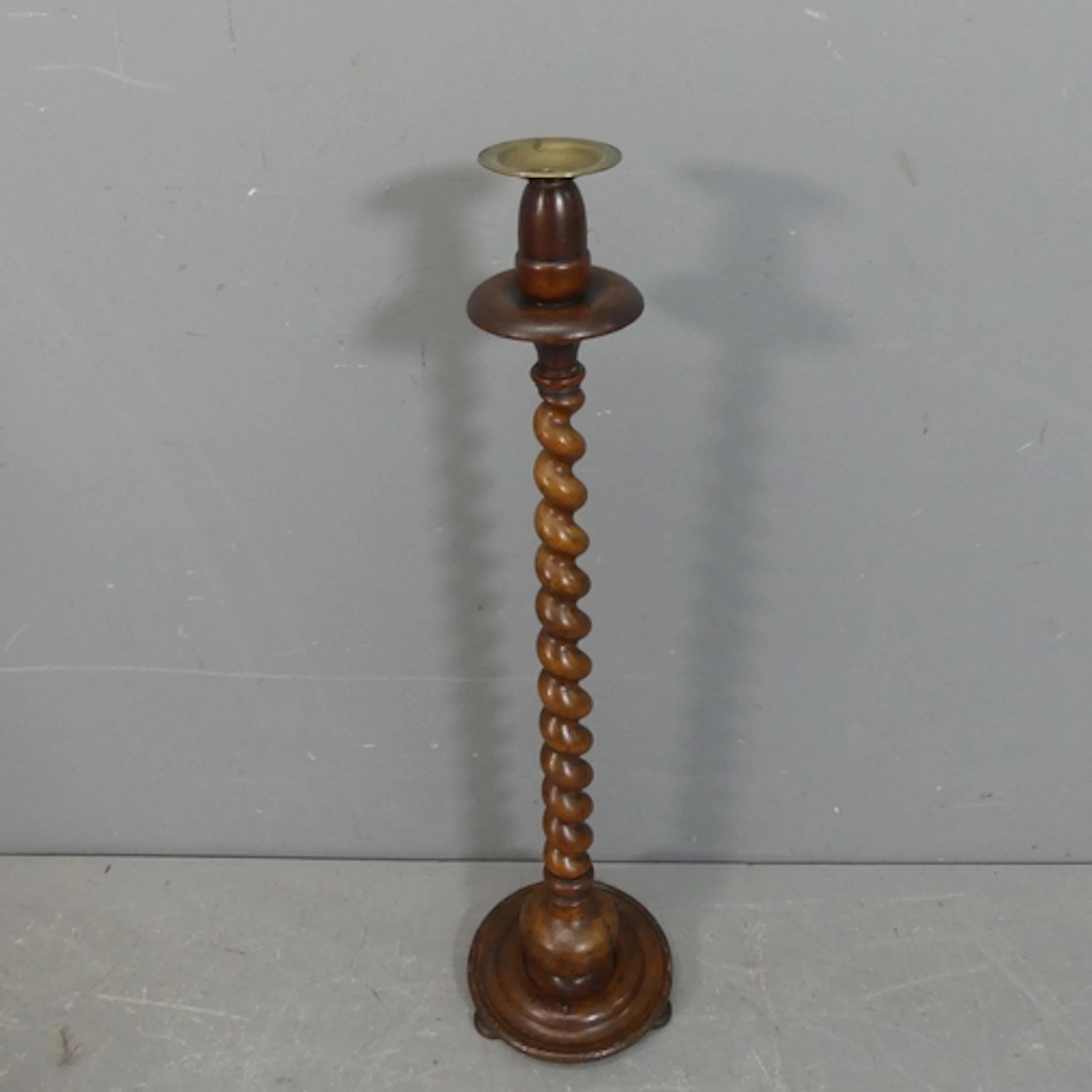 An antique oak and mahogany barley twist candle stand. heigh...