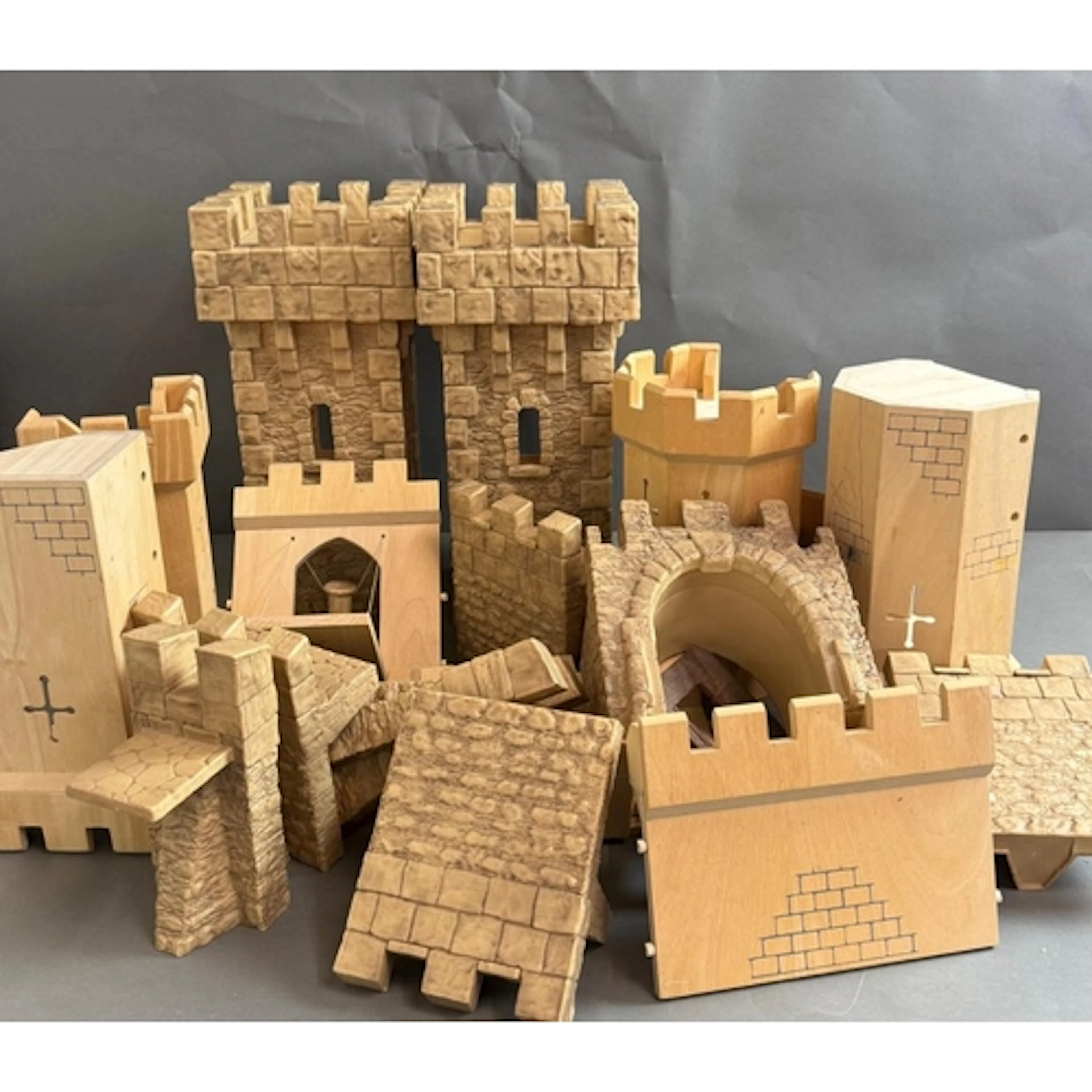 A Toy Castle Set made of wood and plastic.