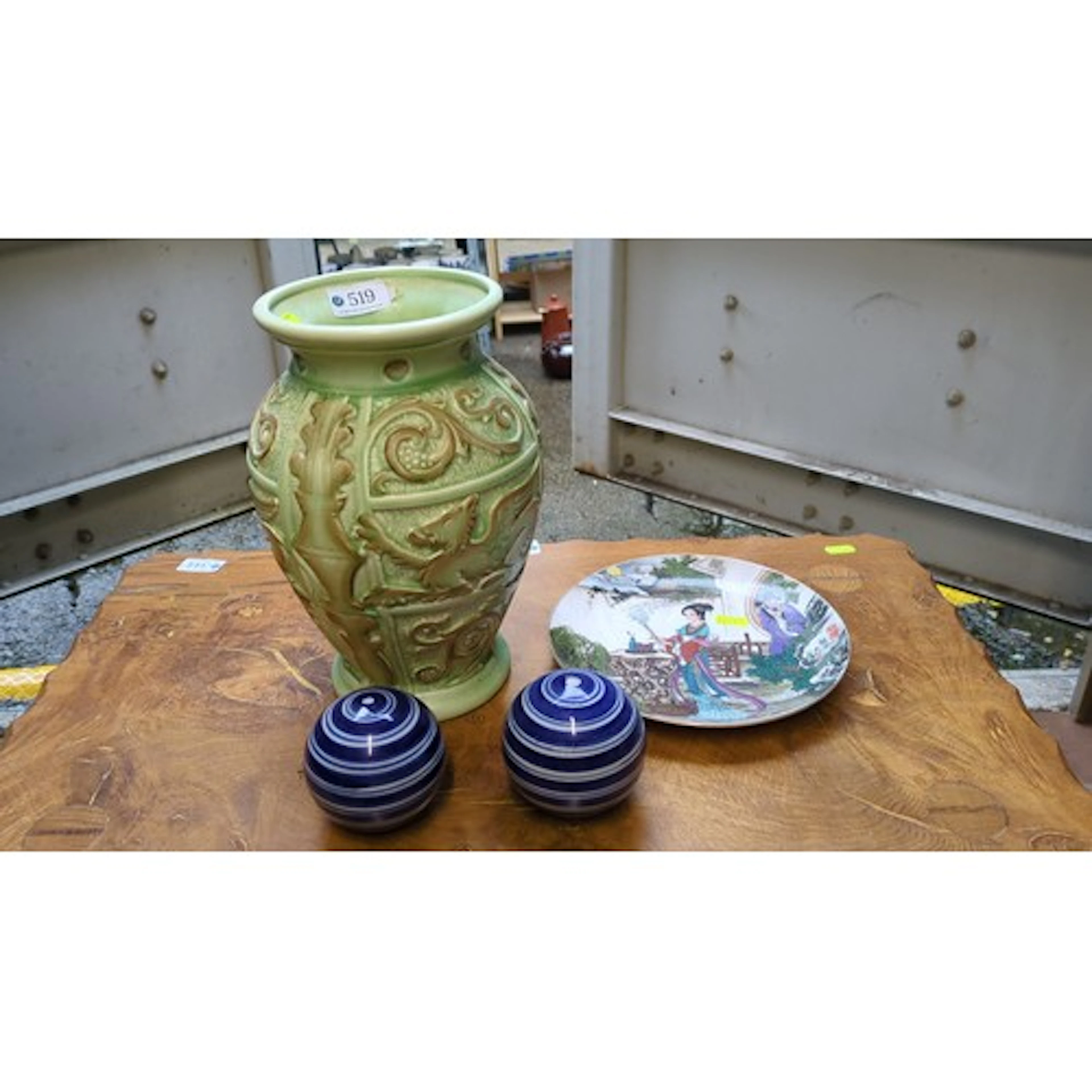A group of ceramics comprising a green glazed relief-moulded...