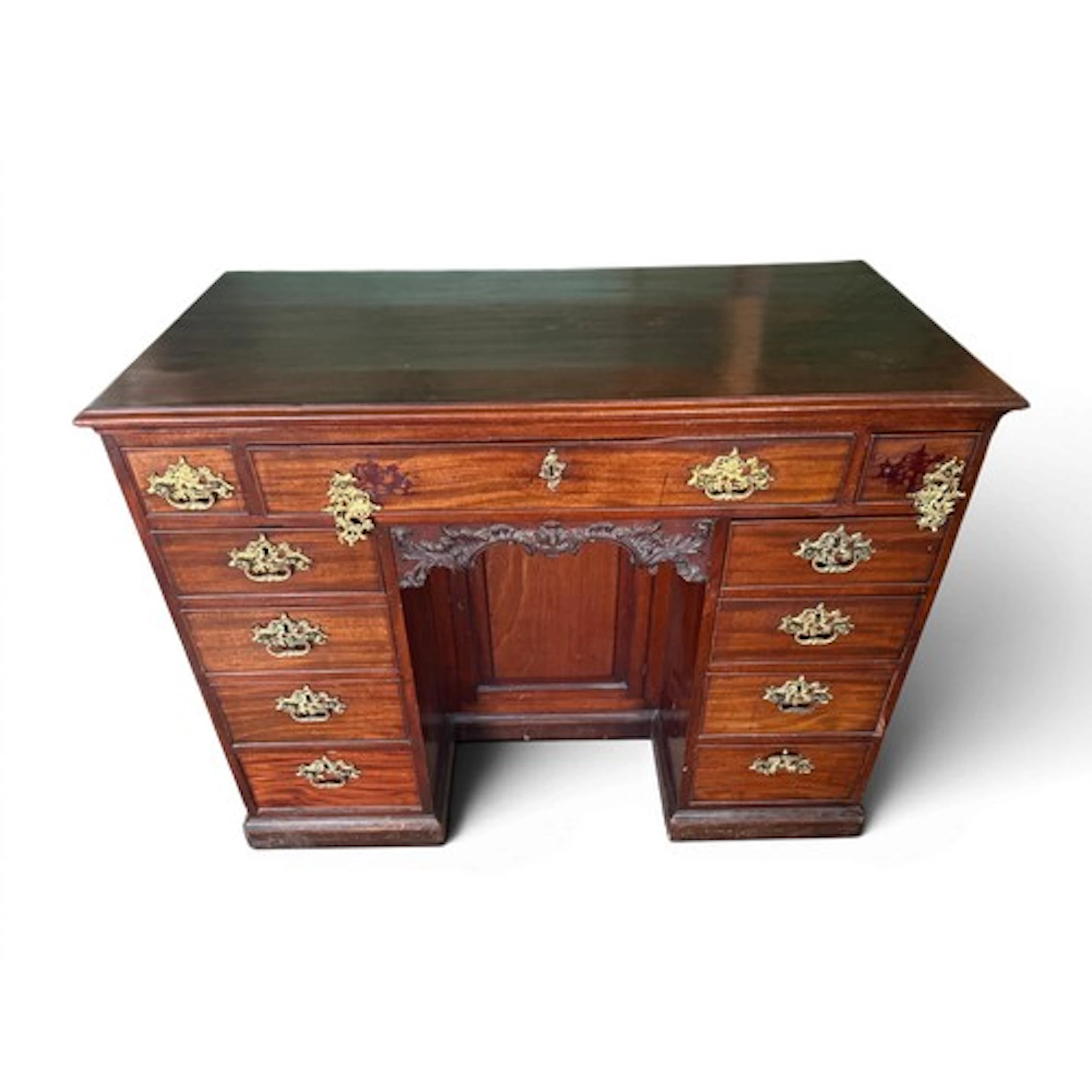An 18thC mahogany kneehole desk with recessed cupboard and c...