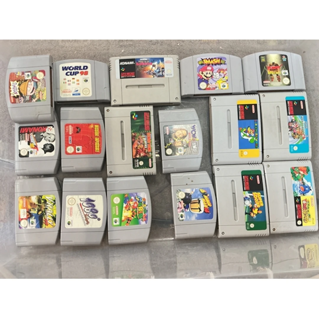 A Collection Of Boxed And Loose Nintendo 64 And Super Ninten...