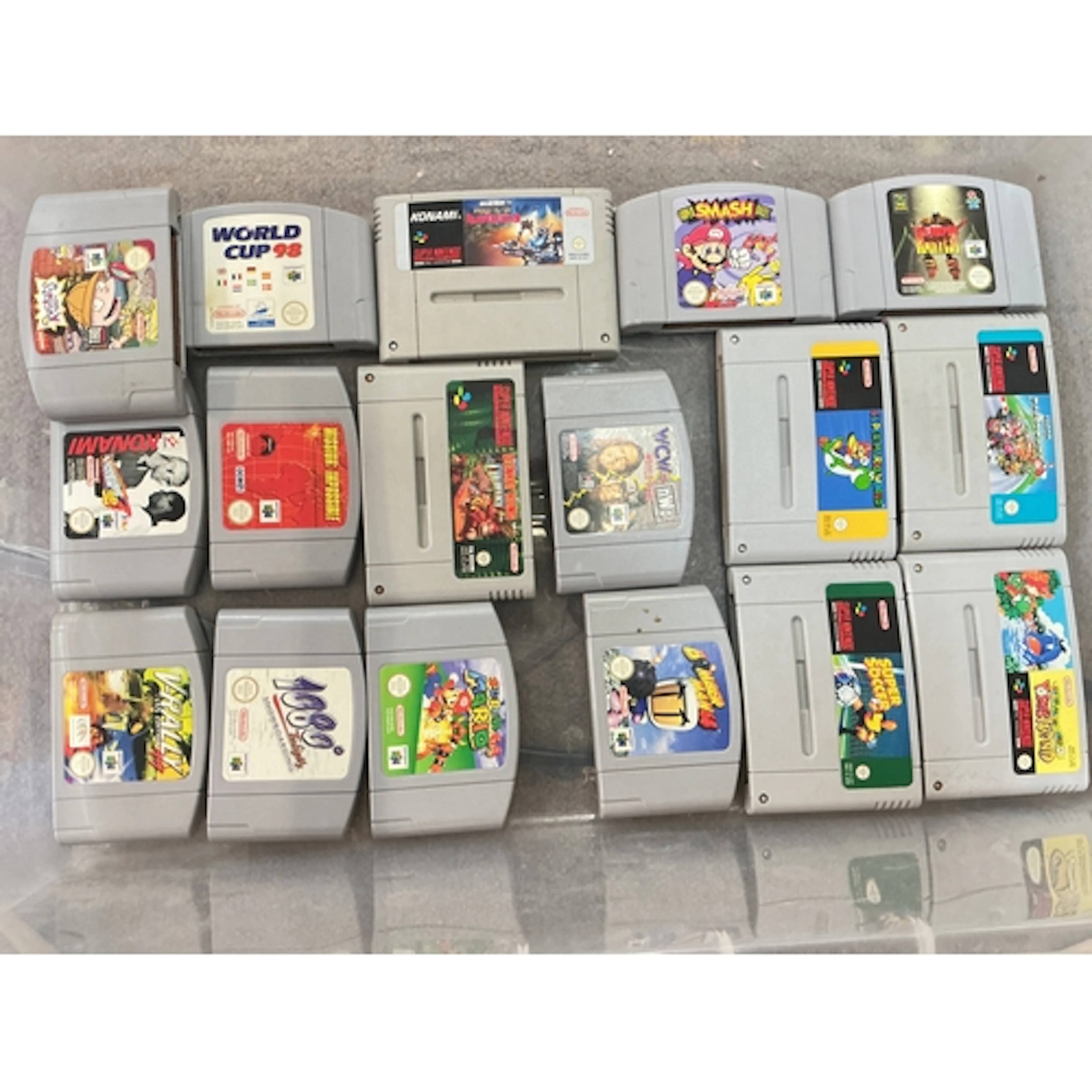 A Collection Of Boxed And Loose Nintendo 64 And Super Ninten...