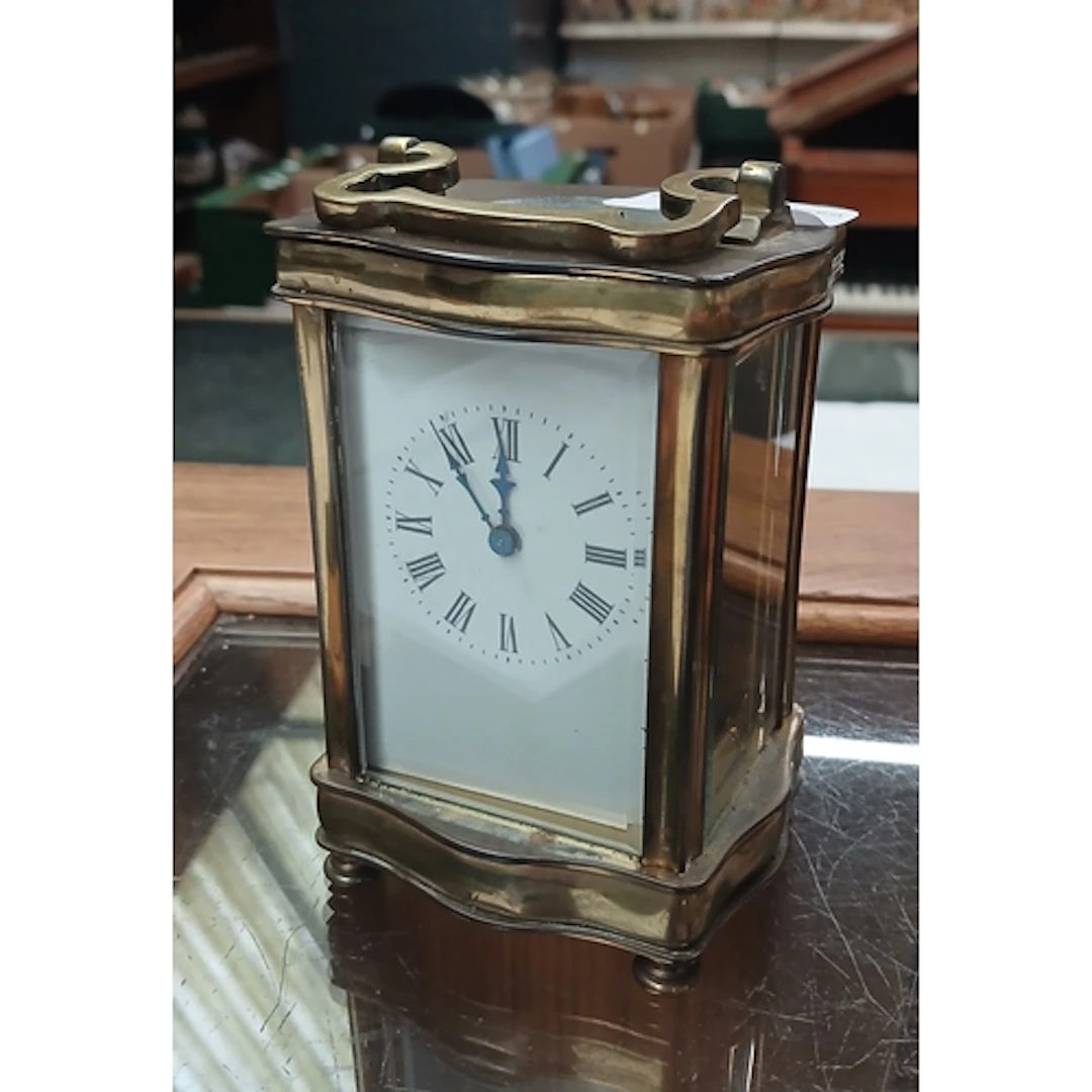 A brass carriage clock.