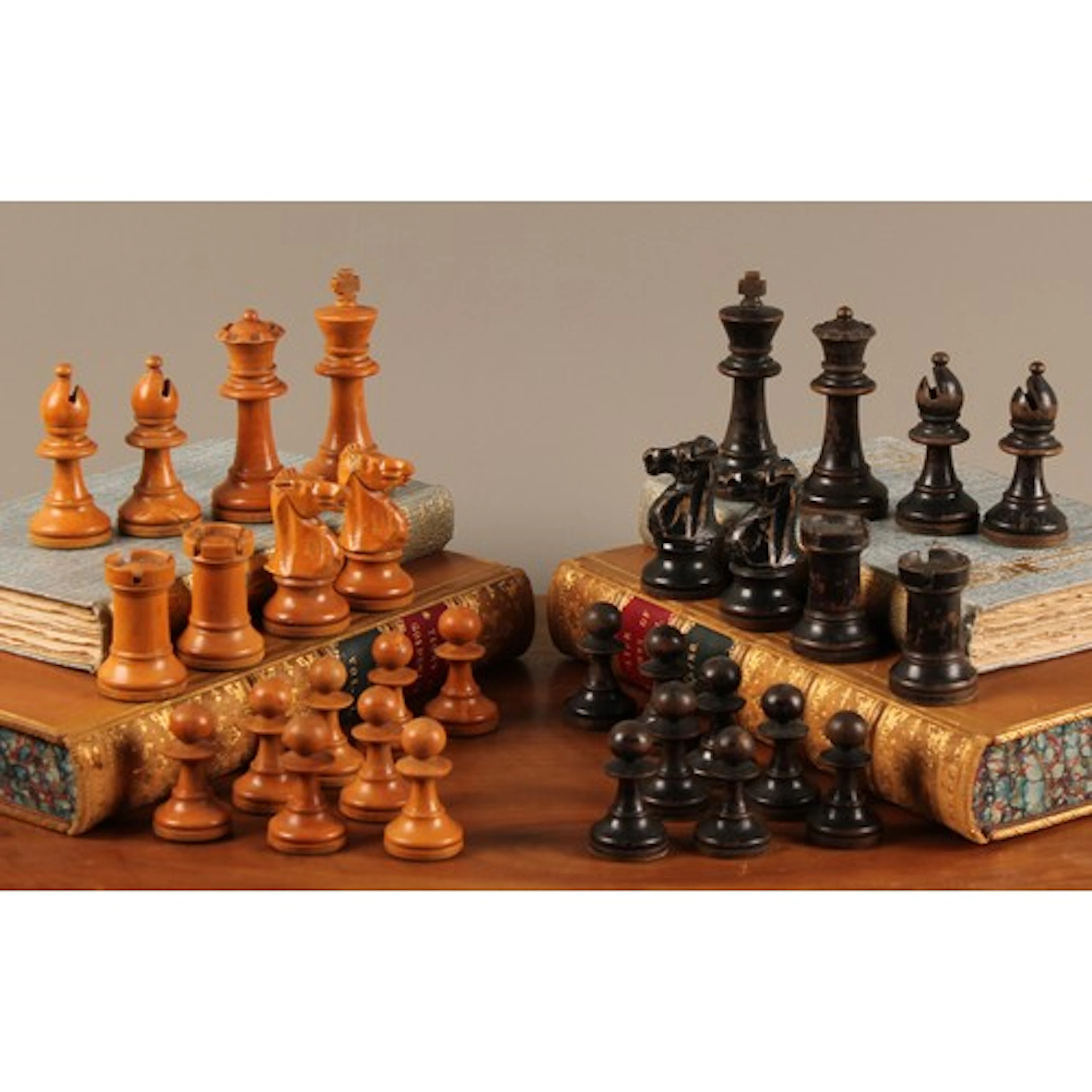 A boxwood and ebonised Staunton pattern chess set, the kings...
