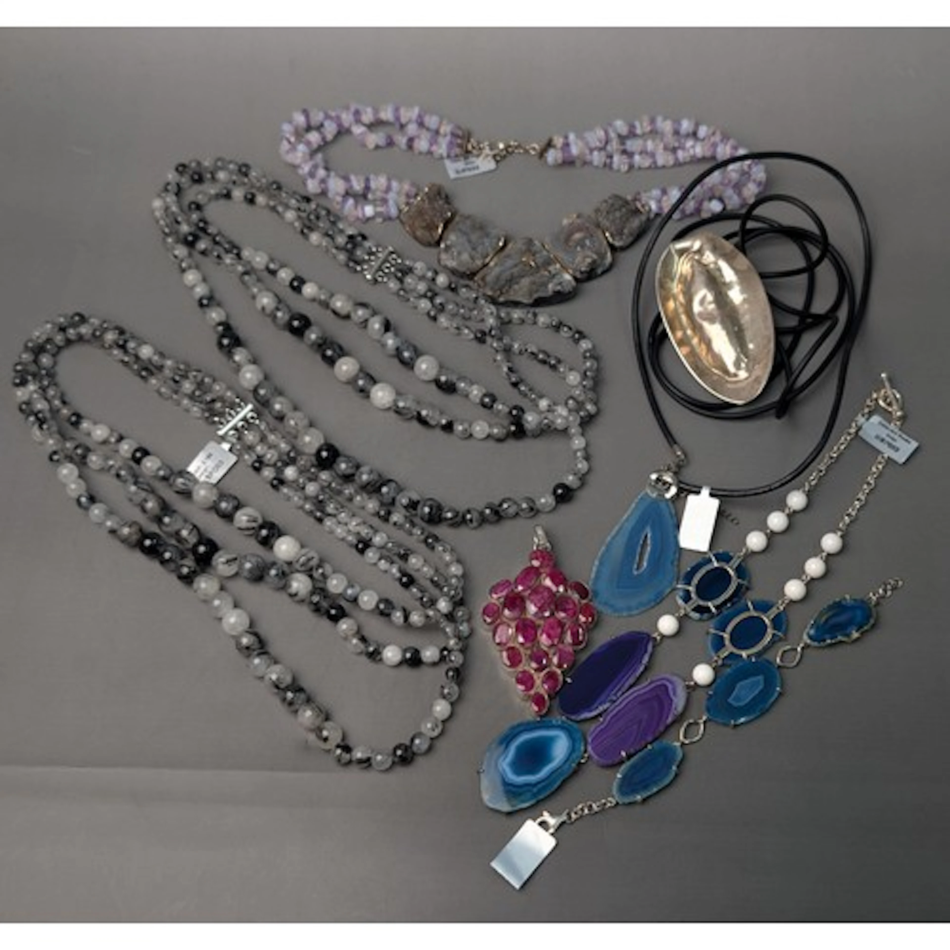 Silver and gemstone statement jewellery, comprising: a neckl...