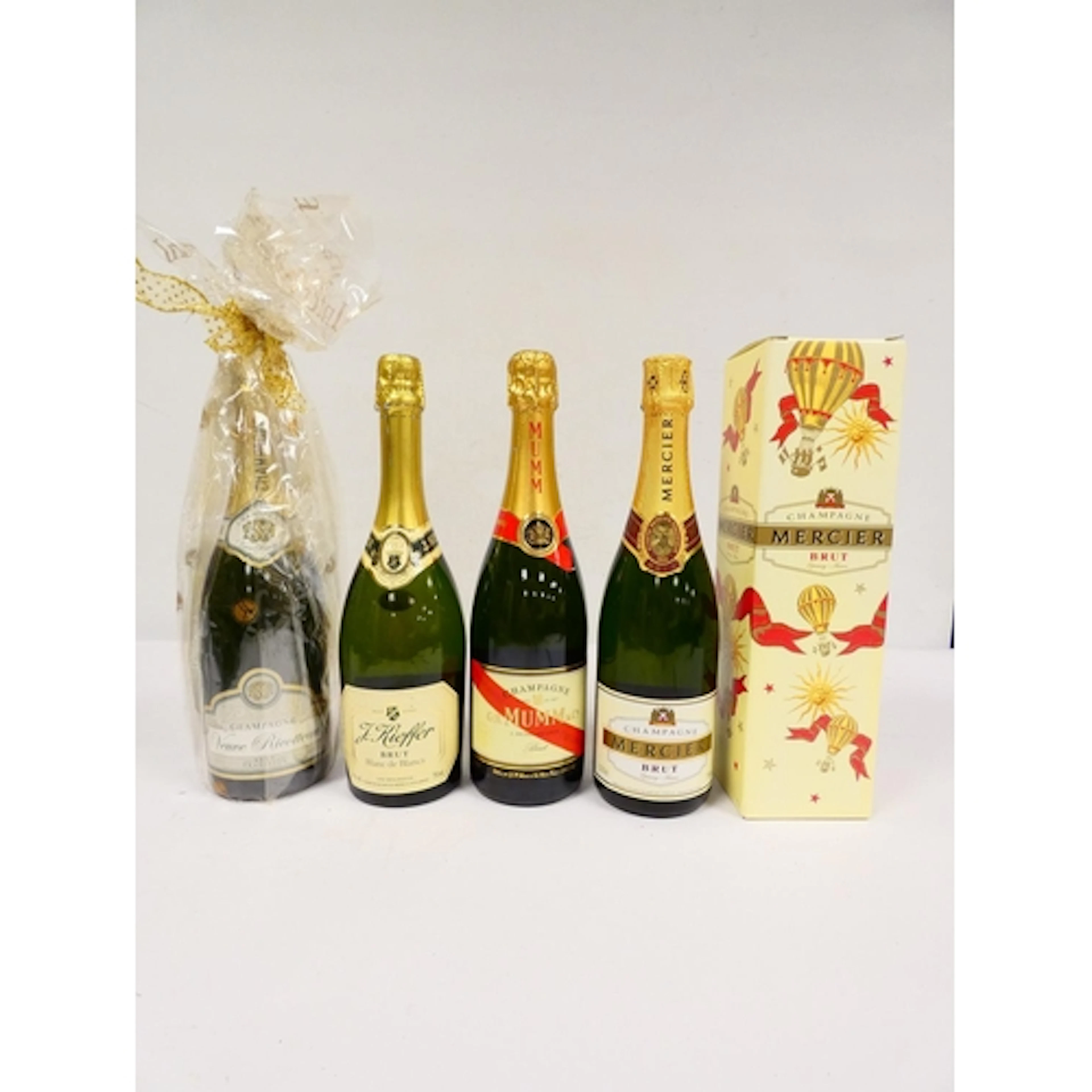 Four bottles of Brut Champagne comprising of Veuve Ricotteau...