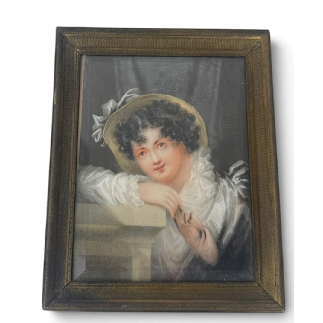 A LATE 19TH CENTURY PORTRAIT MINIATURE OF A LADY HOLDING A M...