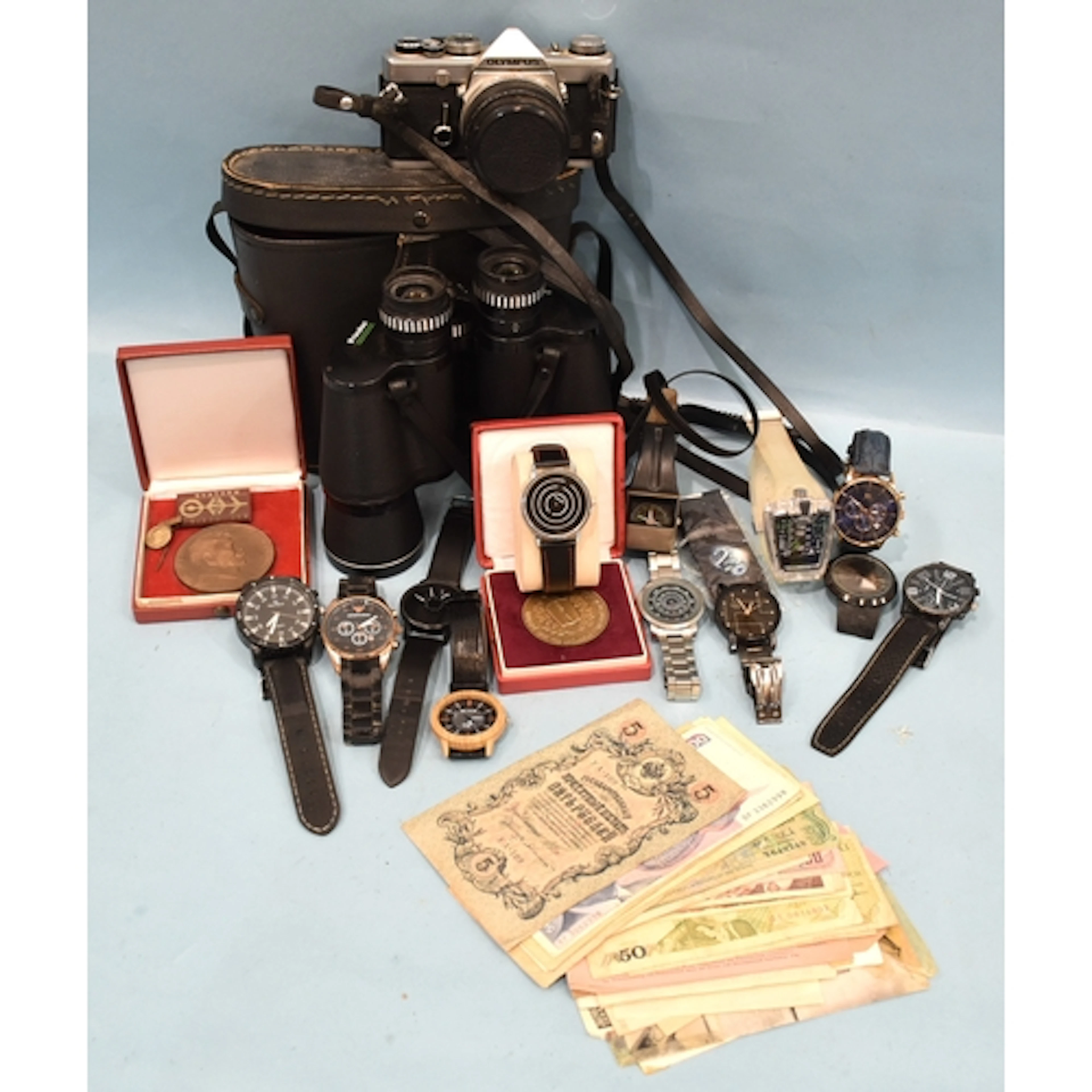 An Olympus OM-1 MD 35mm SLR camera with G Zuiko Auto-S 1:1.4...