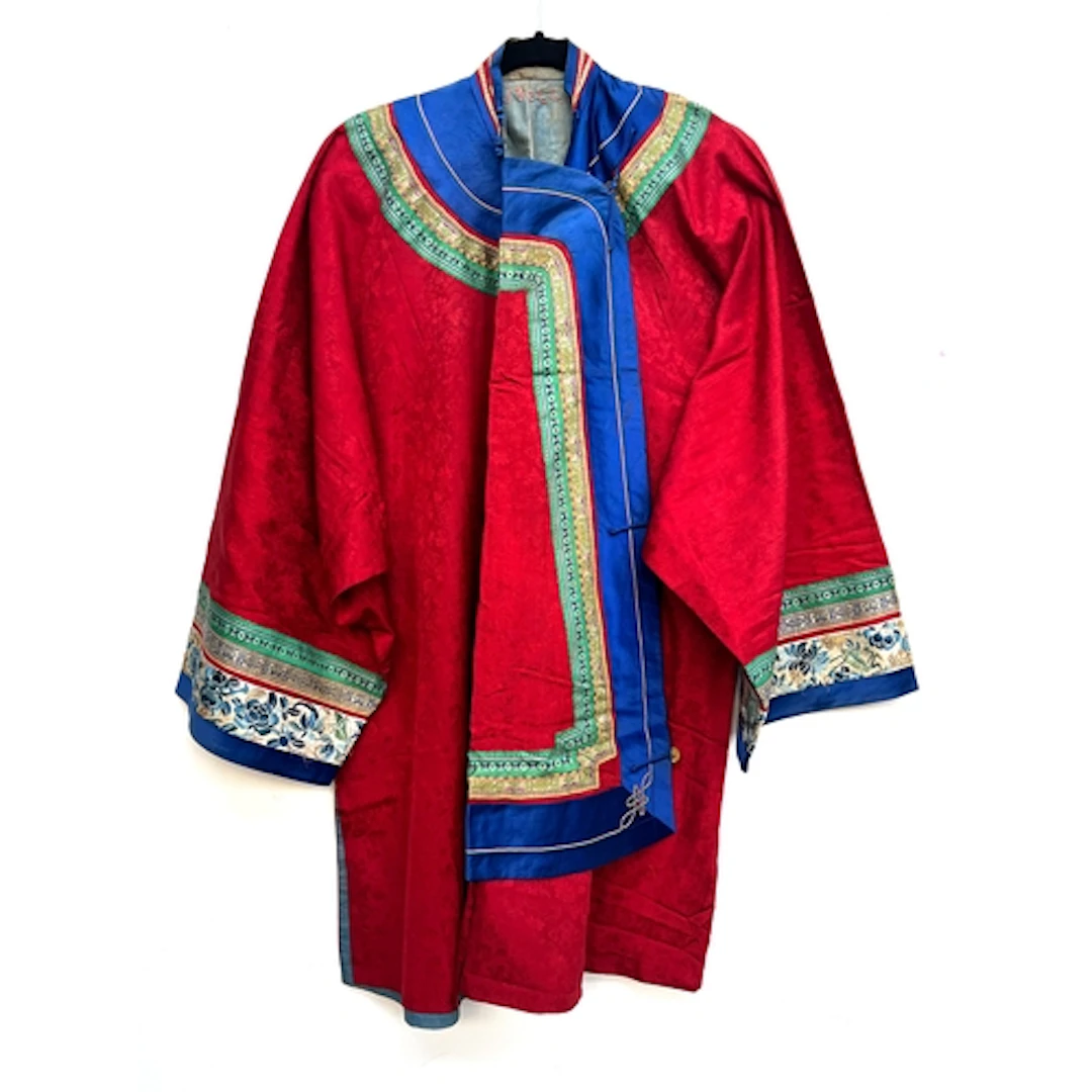 An antique early 20th century Chinese red silk ladies robe, ...