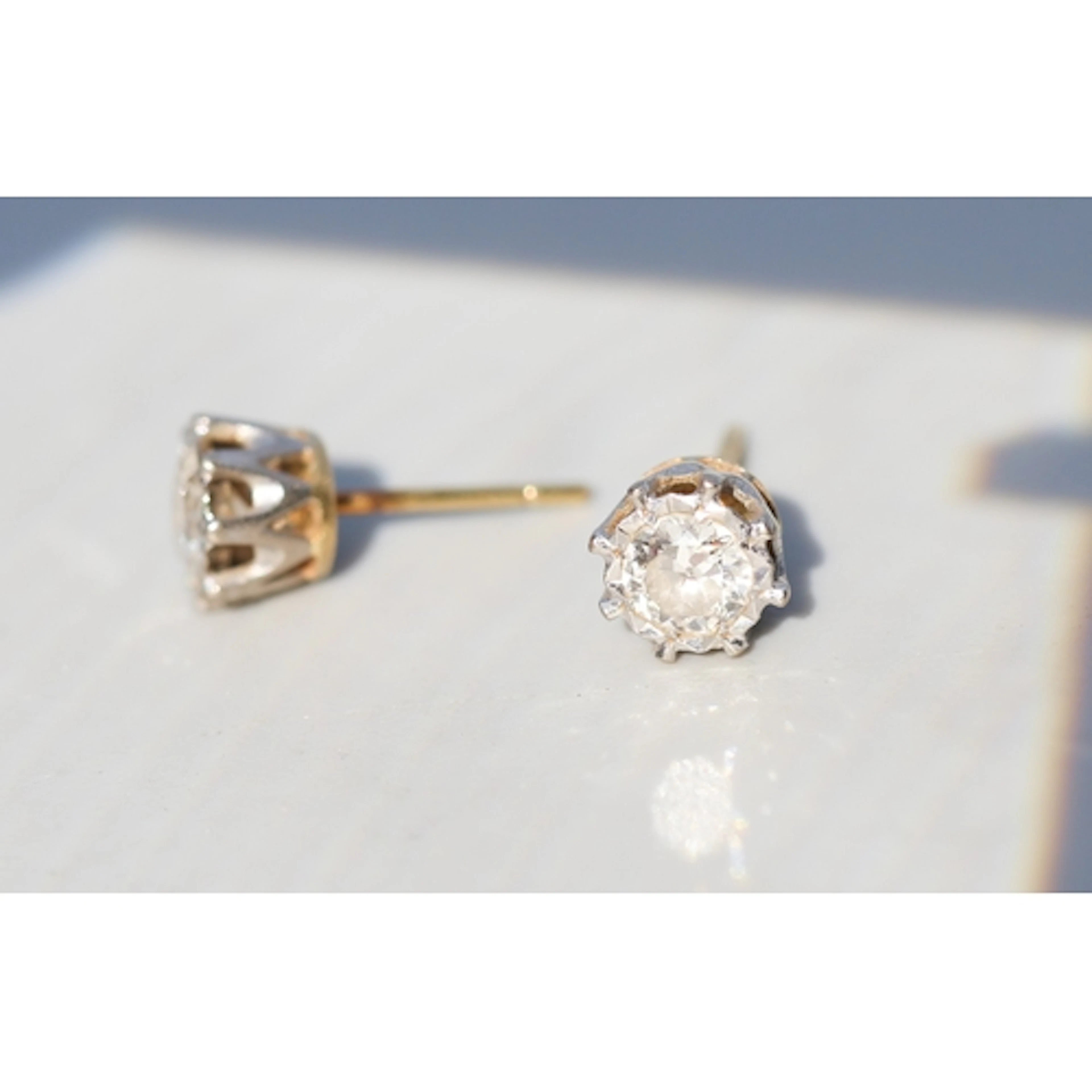 Pair of Diamond Solitaire Earrings, Set in Platinum and Moun...