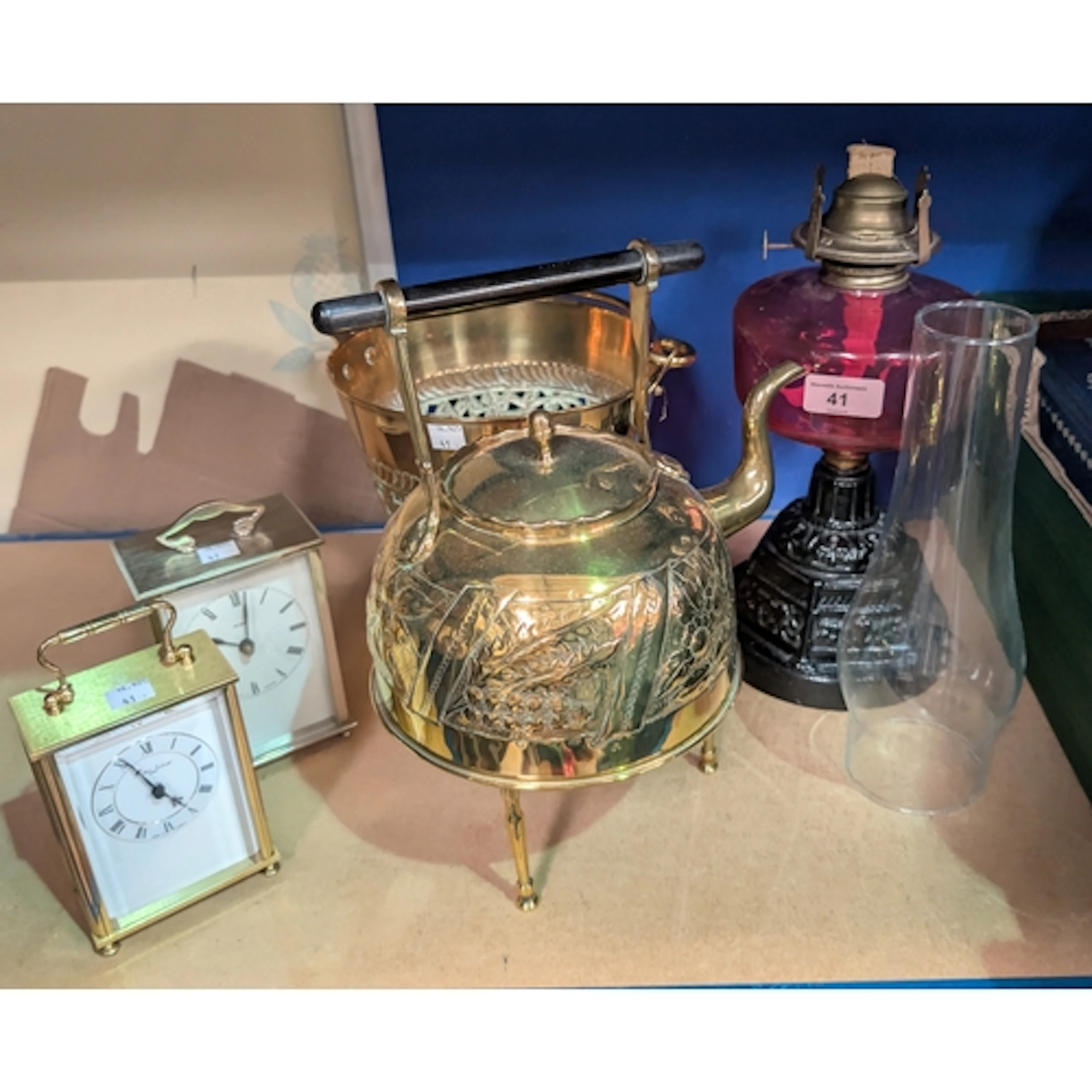 A Vicorian oil lamp with sliced cranberry glass reservoir, a...