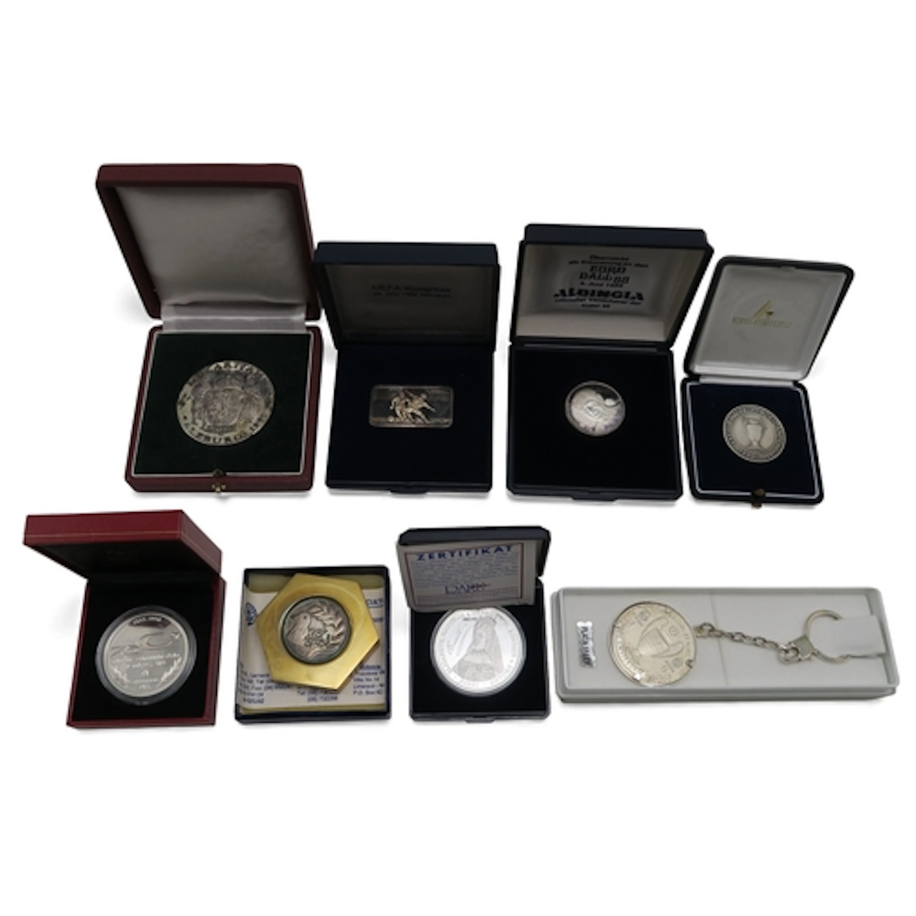 A collection of cased silver presentation medallions, compri...