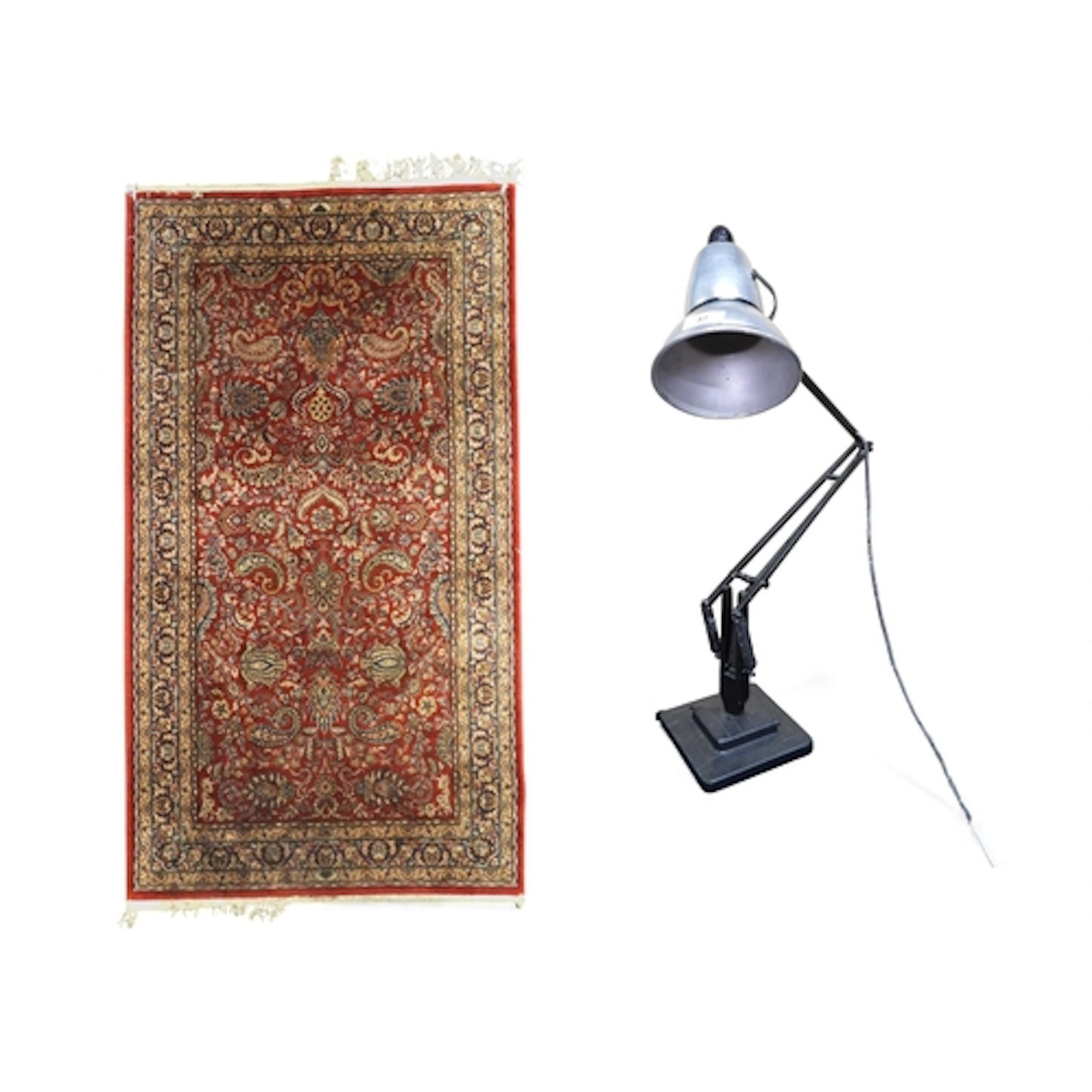 A lot comprising a red ground Persian style rug with foliate...