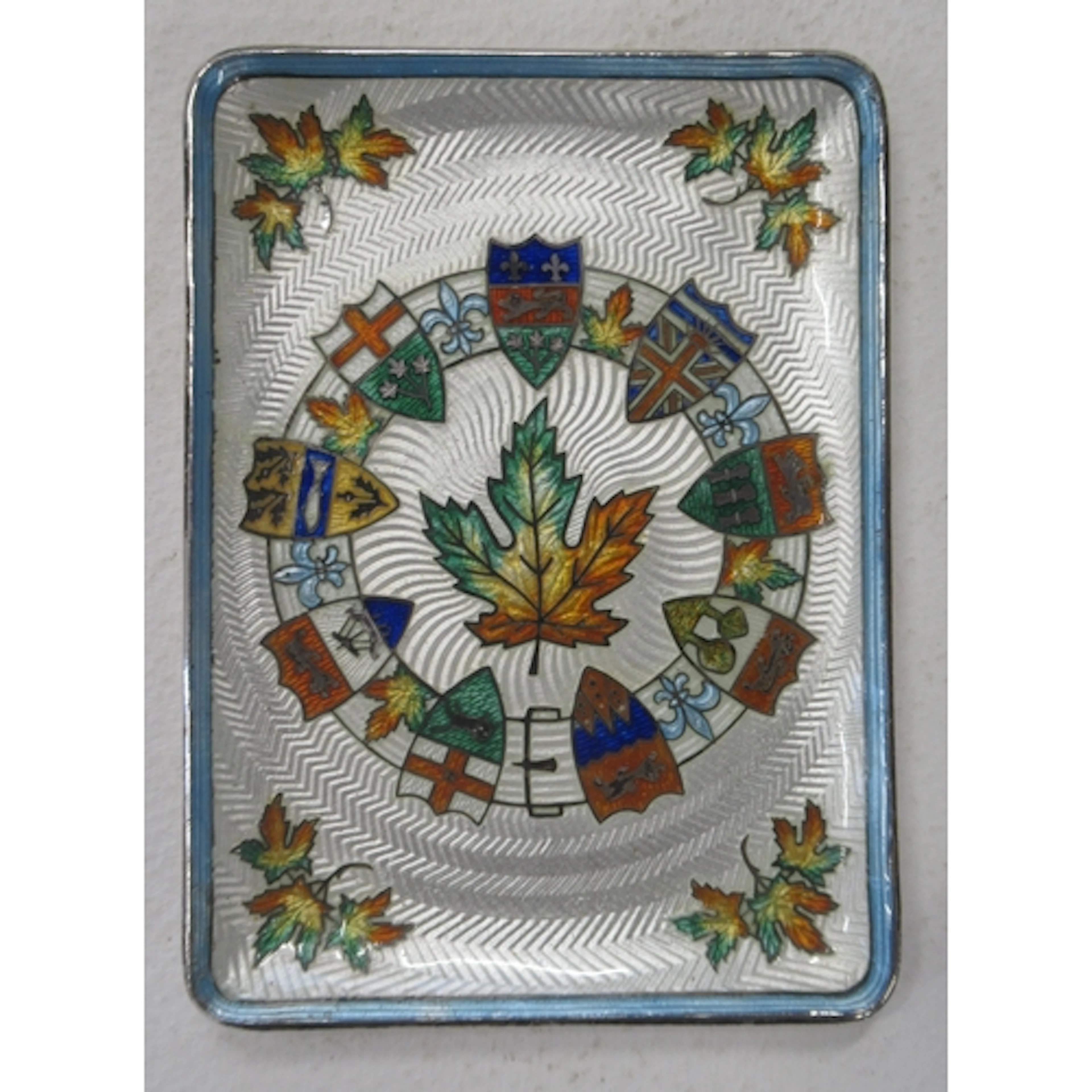 A Sterling silver and enamel dish, decorated with Canadian M...