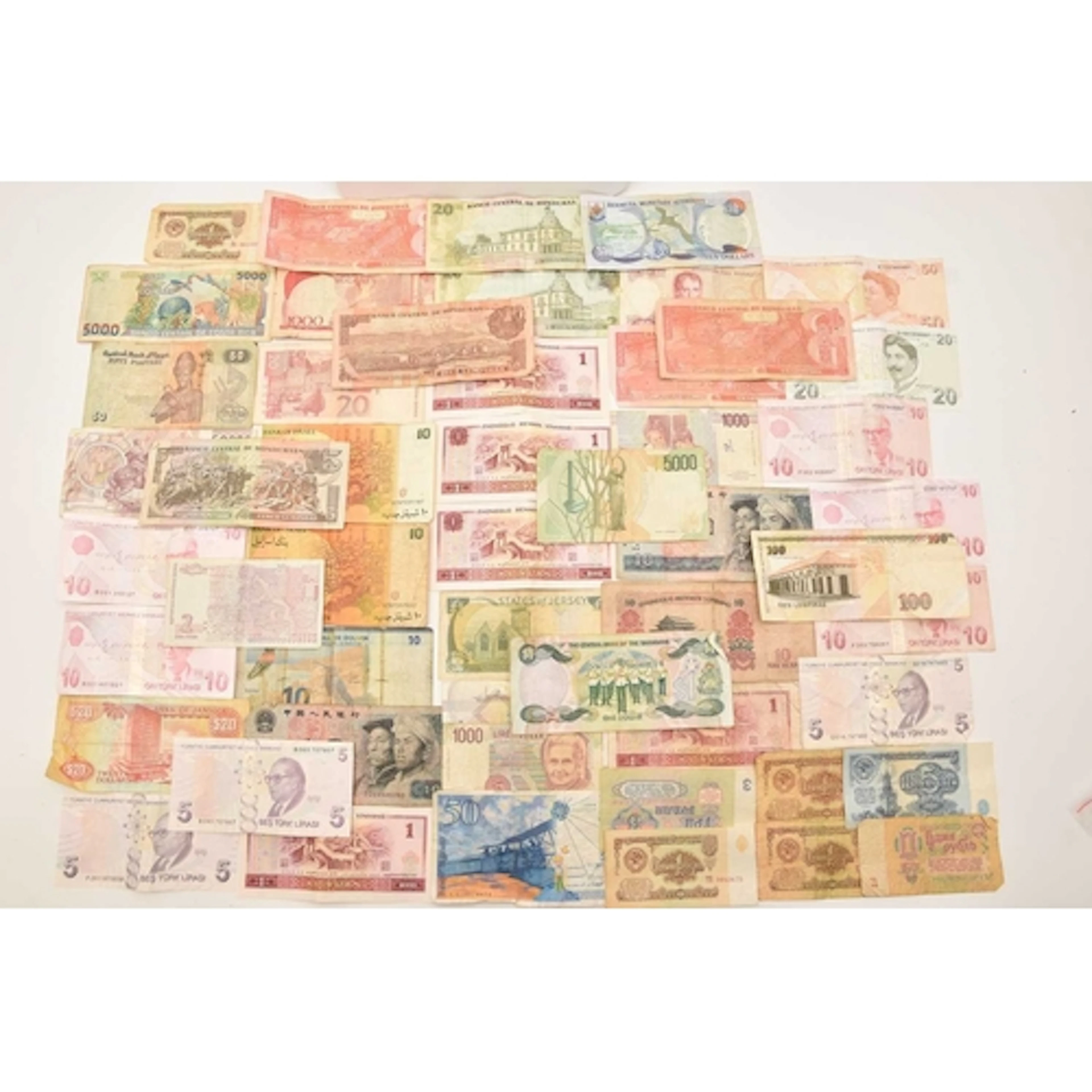 Banknotes. A pouch containing 40 world banknotes, all circul...