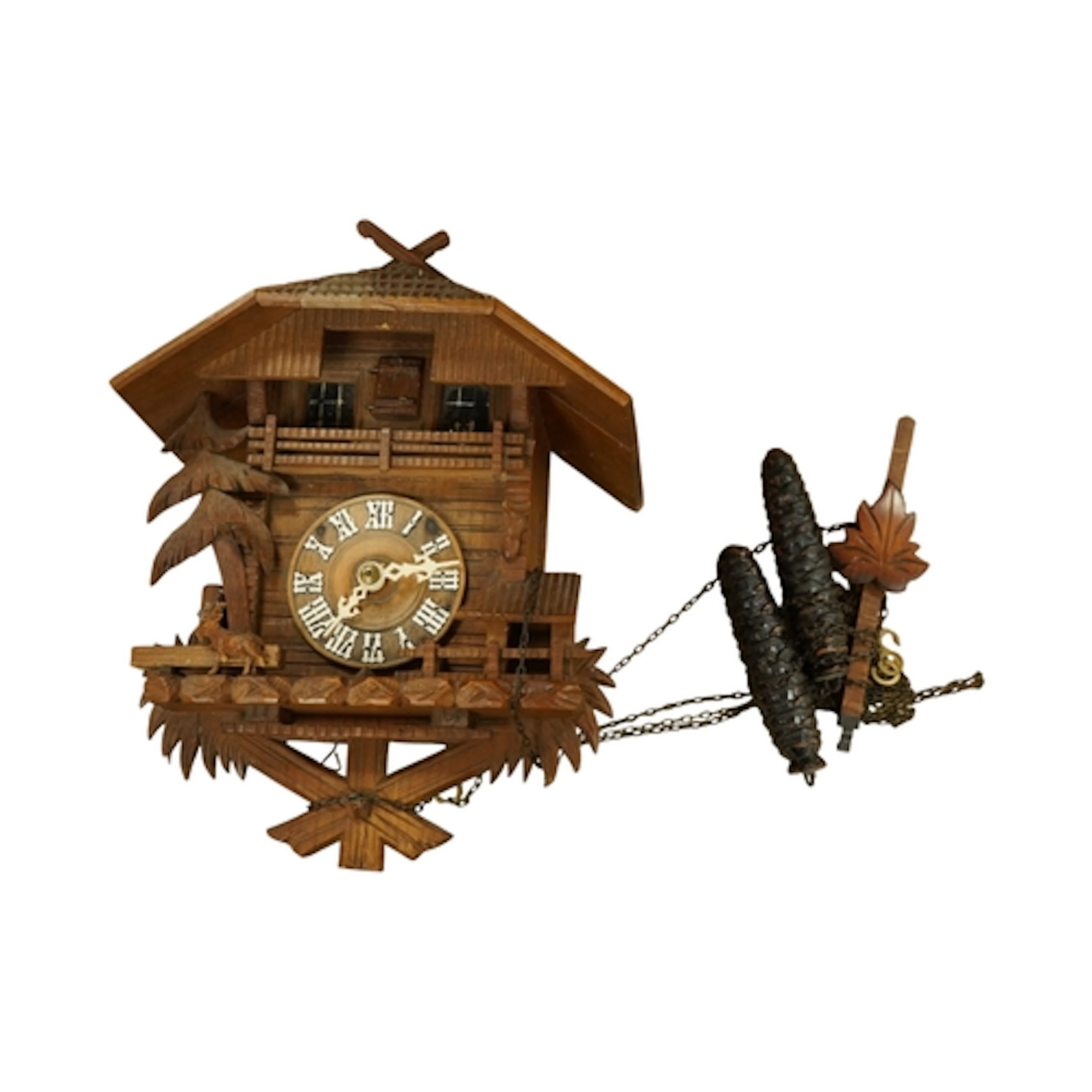 A Black Forest Cuckoo clock, with pinecone weights and pendu...