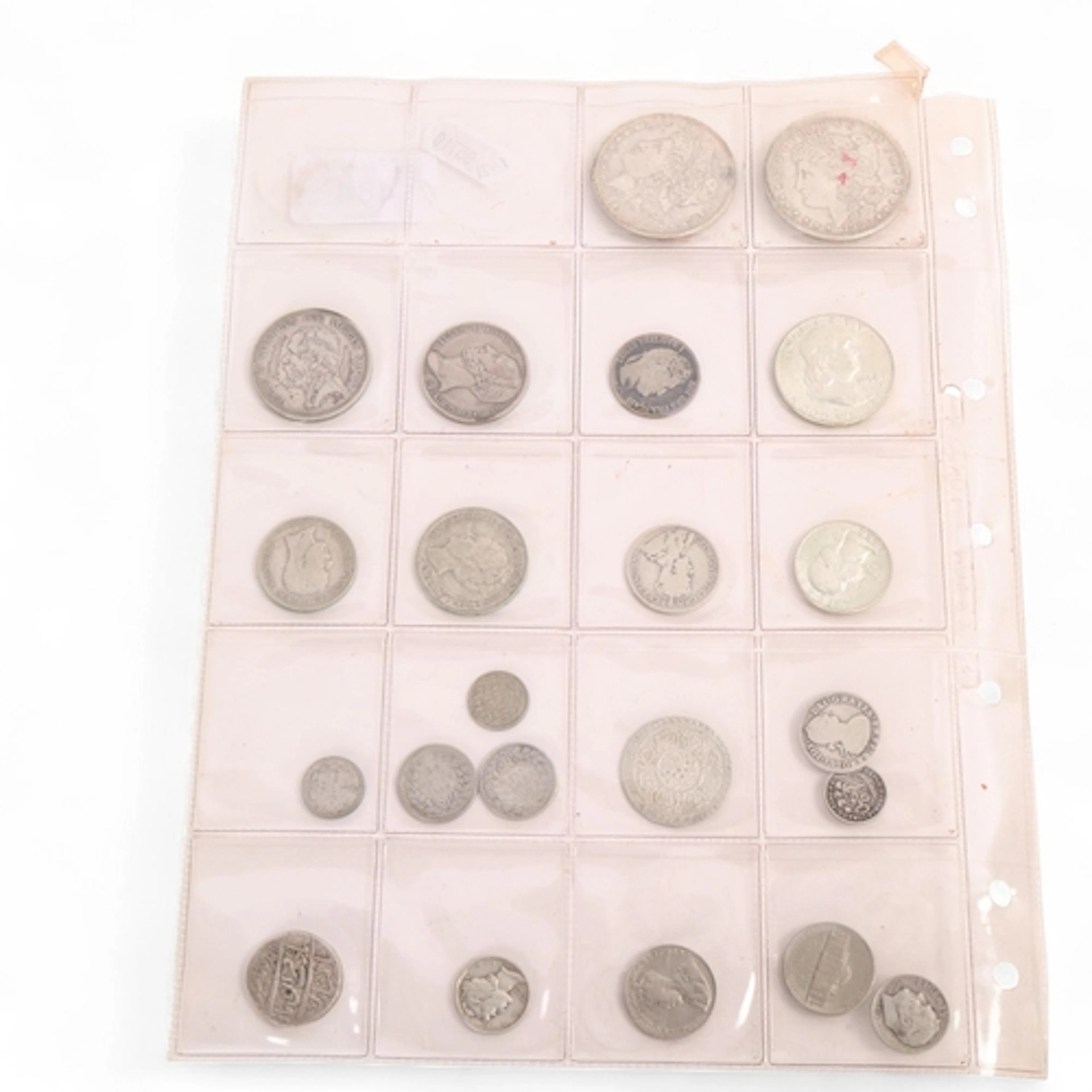 A collection of silver world coinage, including US silver Do...